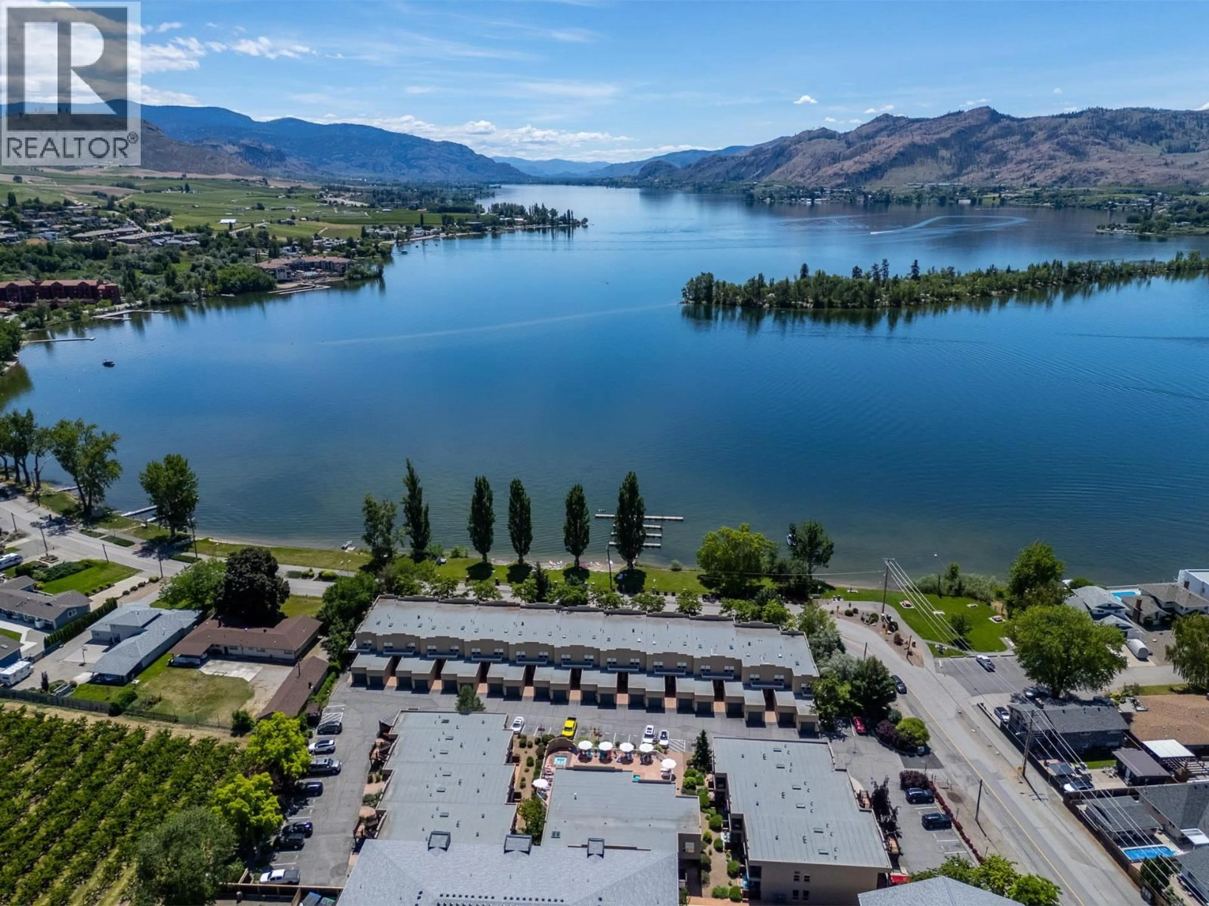 A pic from outside/outdoor area/front of a property/back of a property/a pic from drone, water/lake/river/ocean view for 122 - 5401 LAKESHORE DRIVE, Osoyoos British Columbia V0H1V6