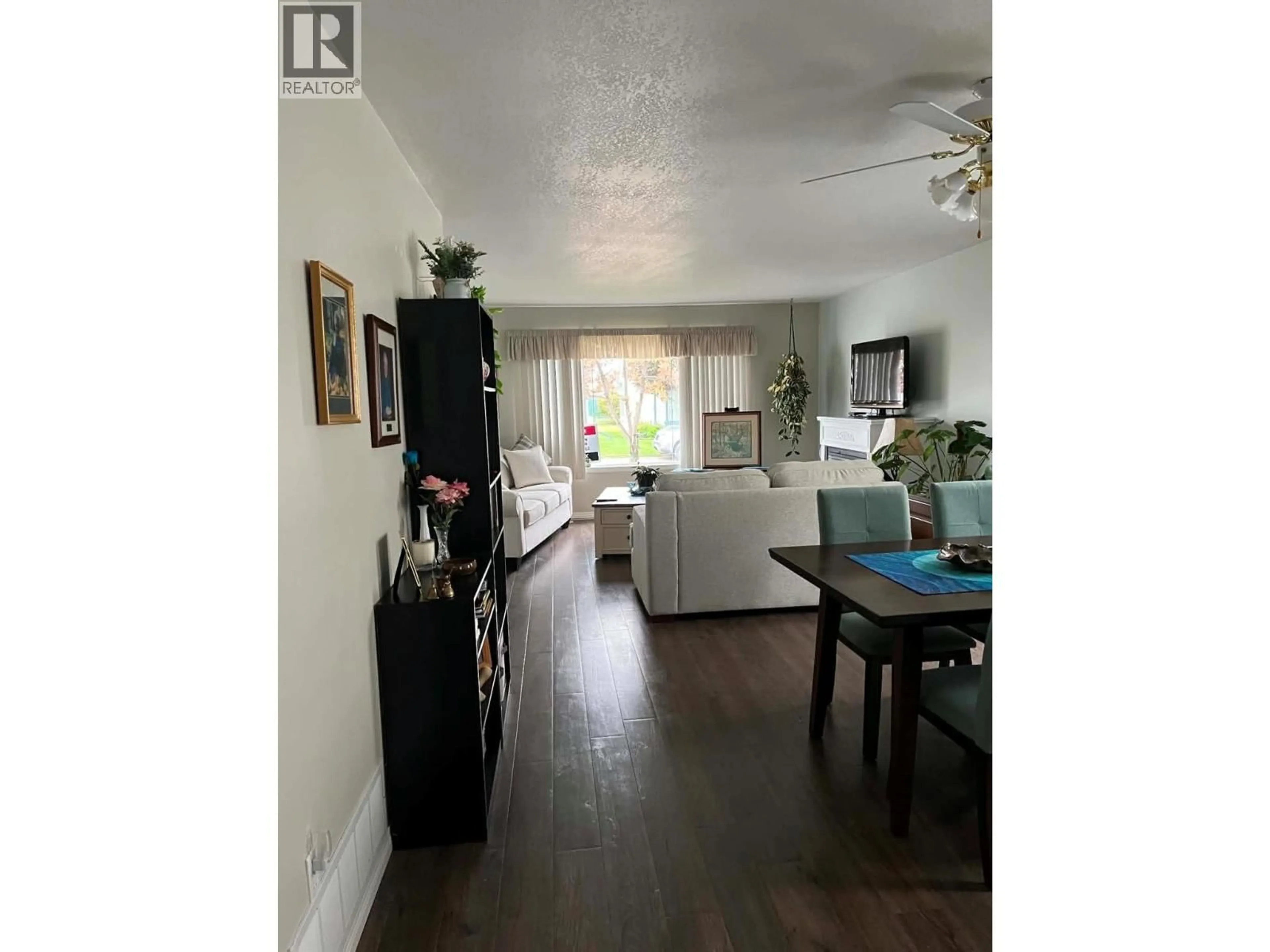 Living room with furniture, wood/laminate floor for 102 - 1708 108 AVENUE, Dawson Creek British Columbia V1G2T7