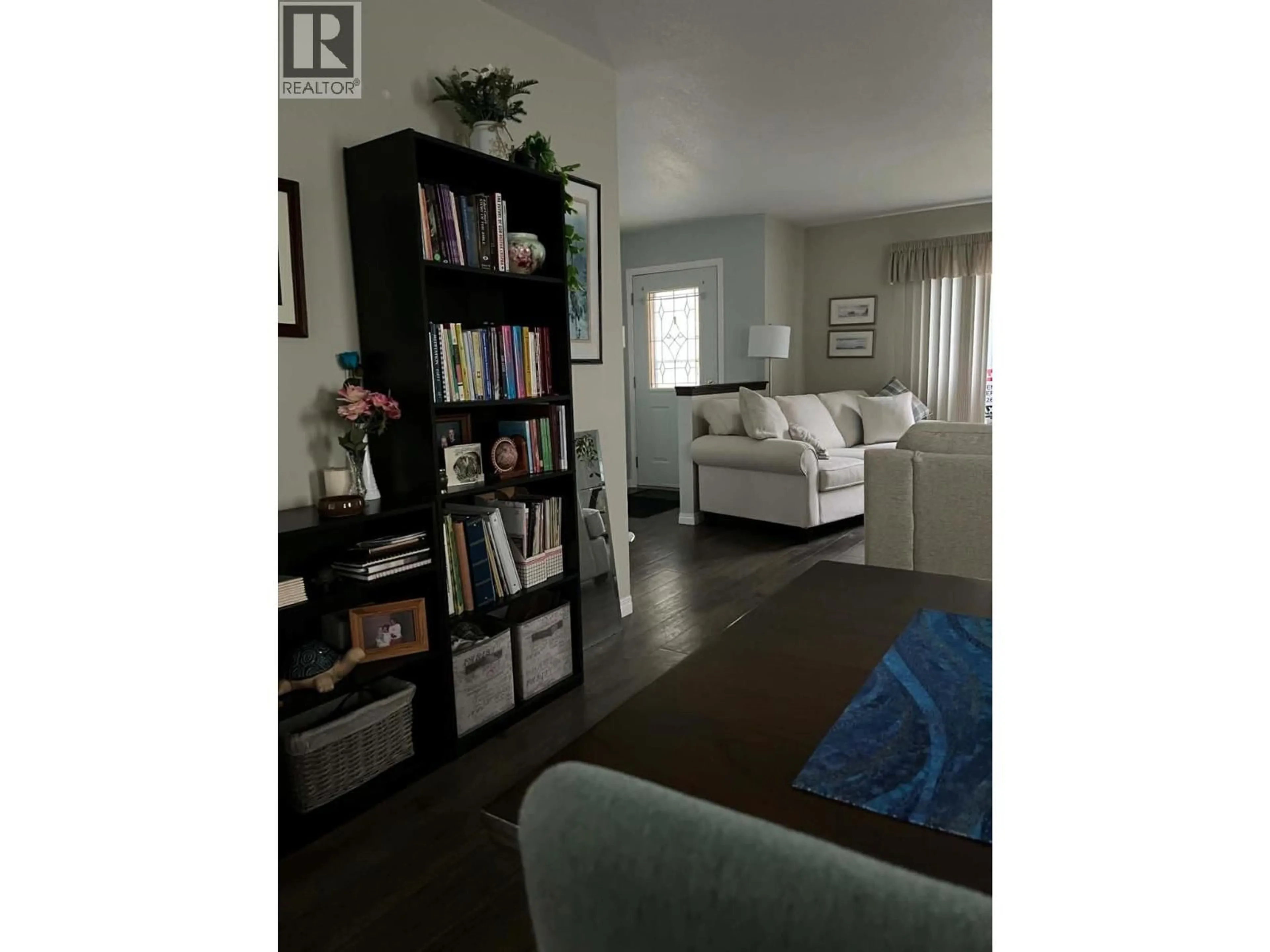 Living room with furniture, wood/laminate floor for 102 - 1708 108 AVENUE, Dawson Creek British Columbia V1G2T7