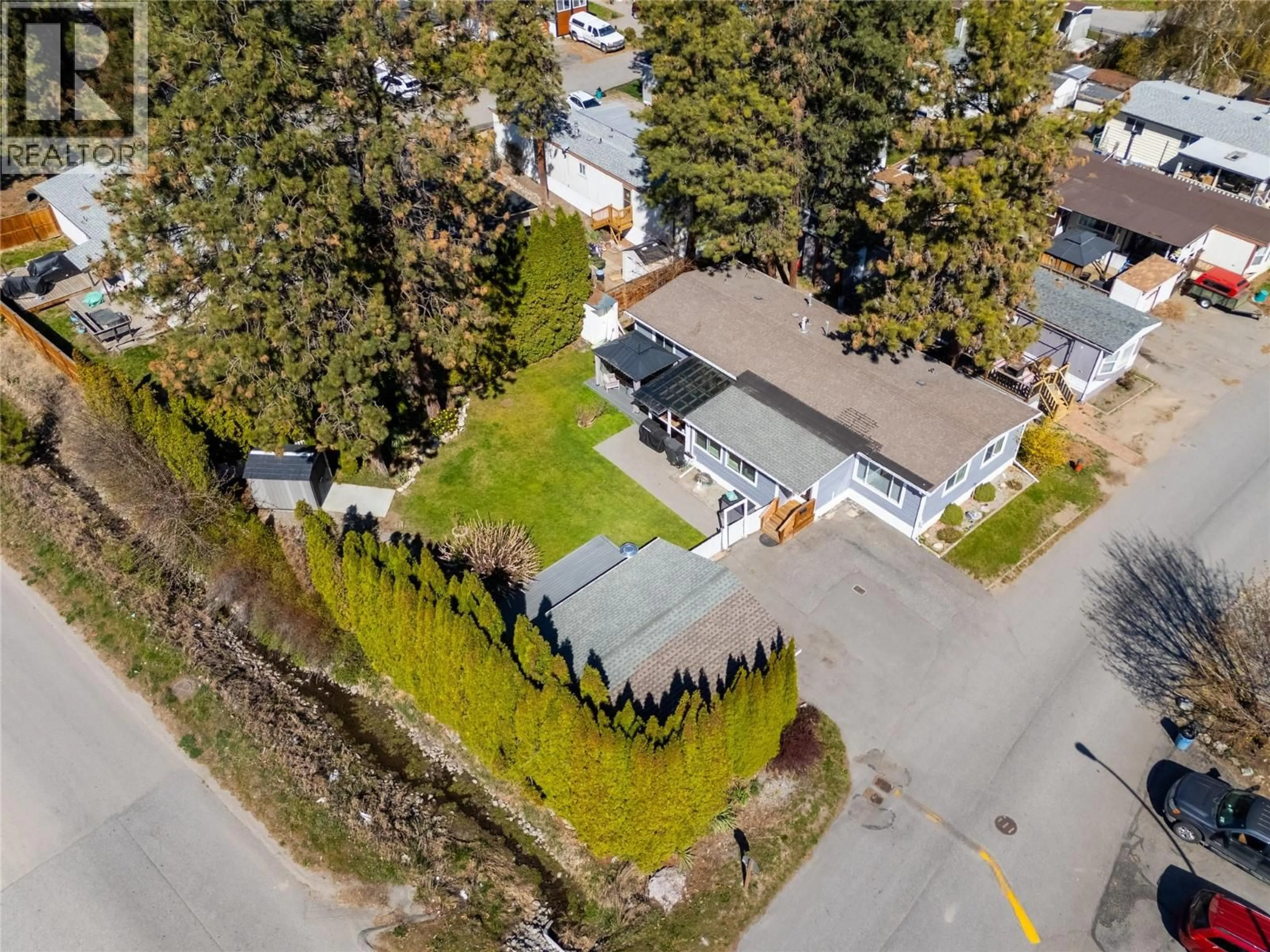 A pic from outside/outdoor area/front of a property/back of a property/a pic from drone, street for 266 - 1999 97 HIGHWAY SOUTH, West Kelowna British Columbia V1Z1B2