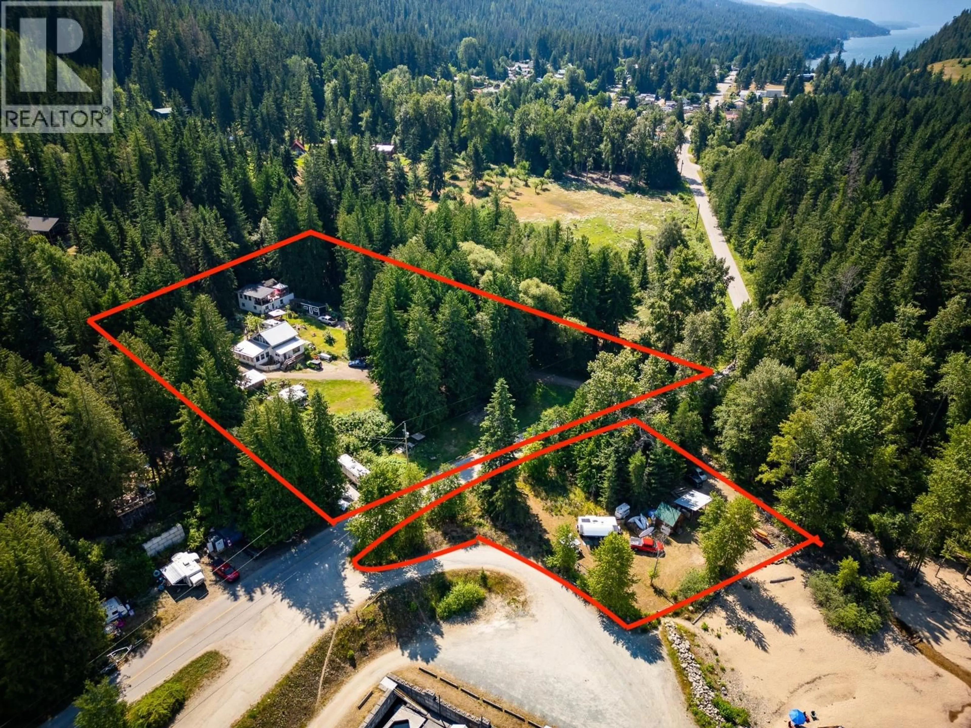 A pic from outside/outdoor area/front of a property/back of a property/a pic from drone, forest/trees view for 1766 RIONDEL  N ROAD, Riondel British Columbia V0B2B0