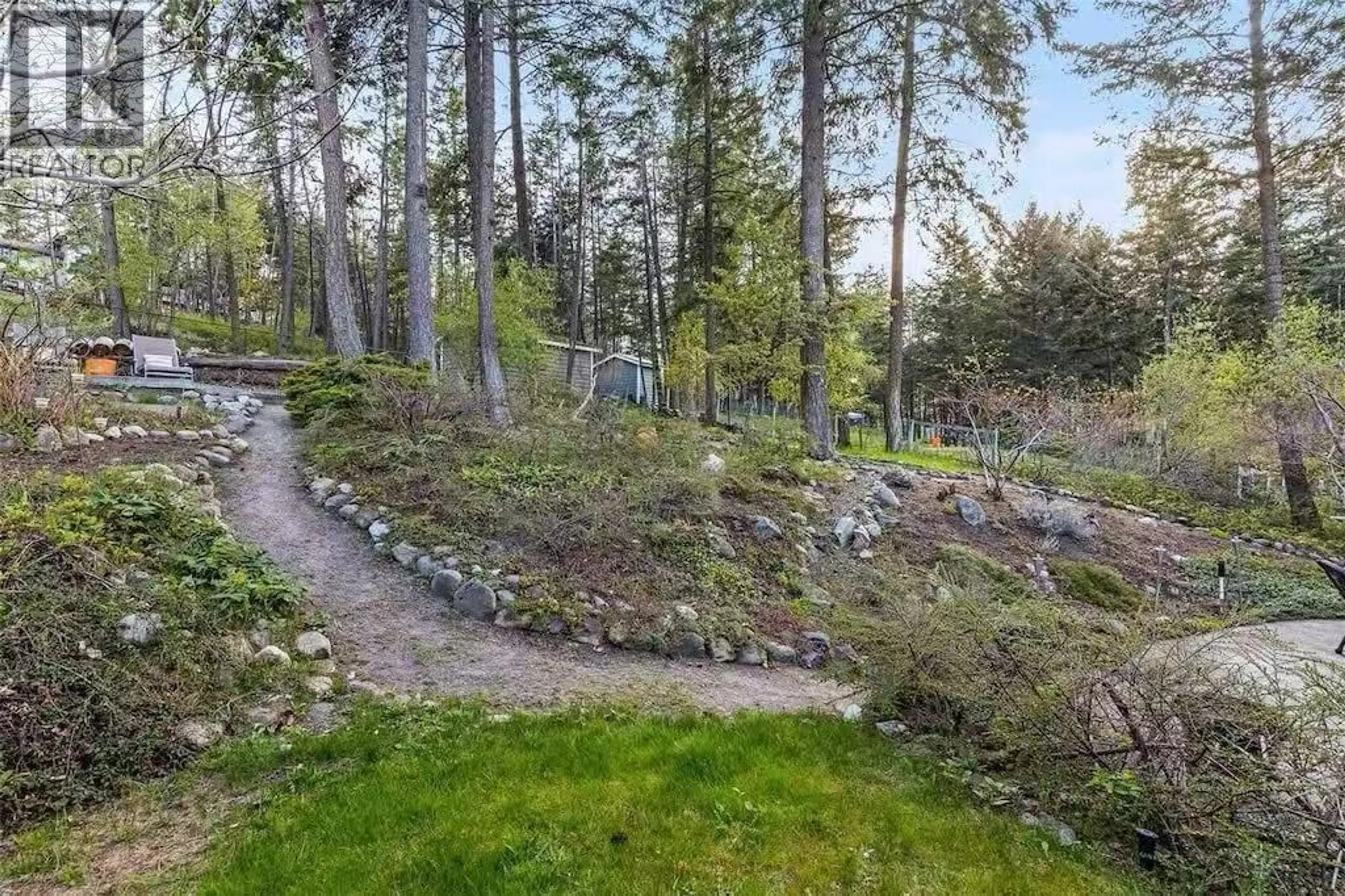 A pic from outside/outdoor area/front of a property/back of a property/a pic from drone, forest/trees view for 945 LLOYD JONES DRIVE, West Kelowna British Columbia V1Z2X9