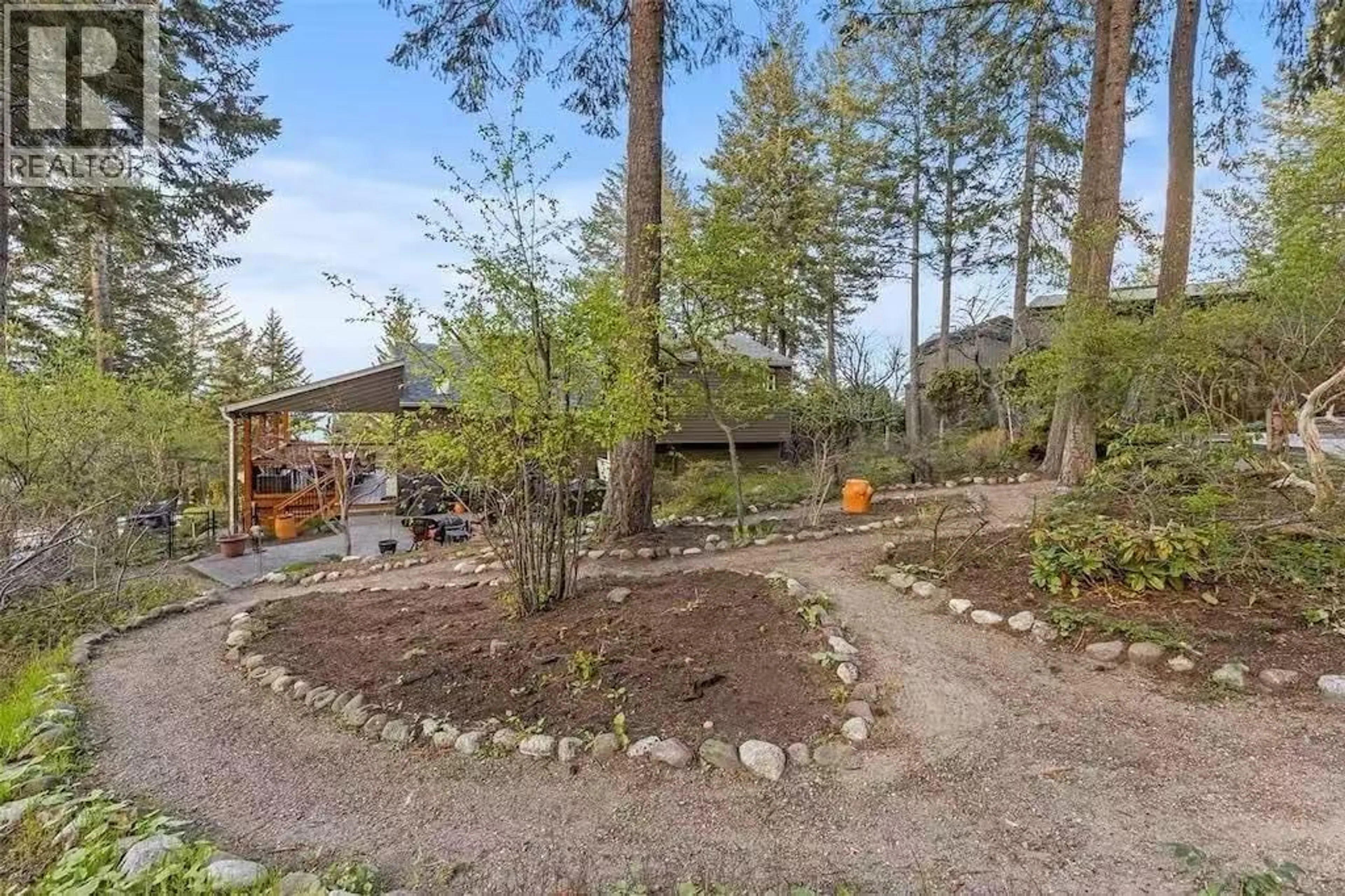 A pic from outside/outdoor area/front of a property/back of a property/a pic from drone, forest/trees view for 945 LLOYD JONES DRIVE, West Kelowna British Columbia V1Z2X9