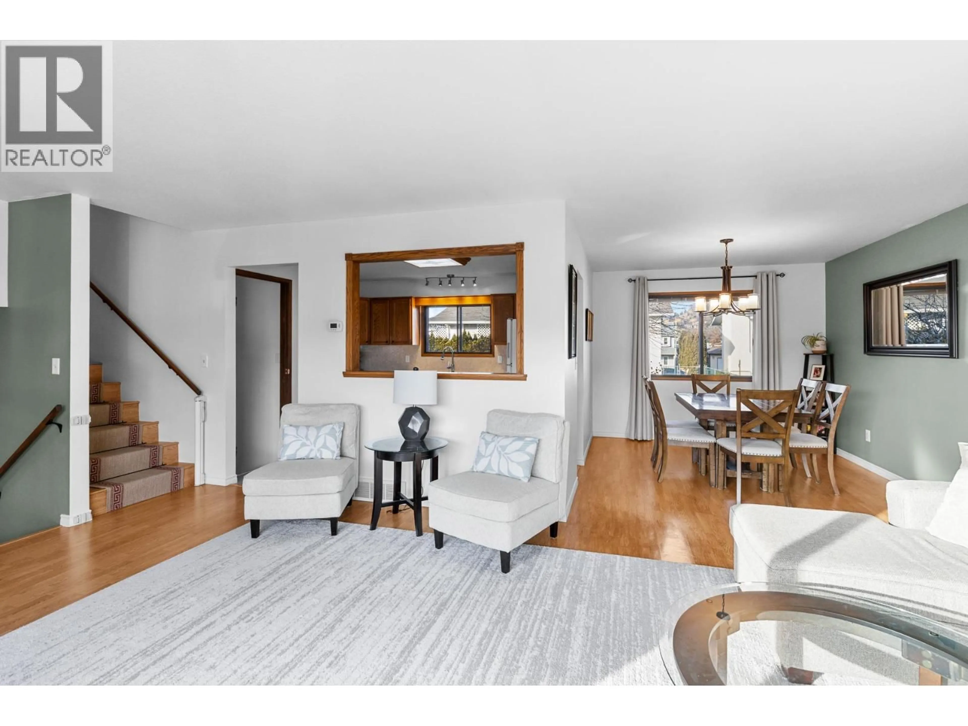 Living room with furniture, wood/laminate floor for 280 KNELLER ROAD, Kelowna British Columbia V1X7A1