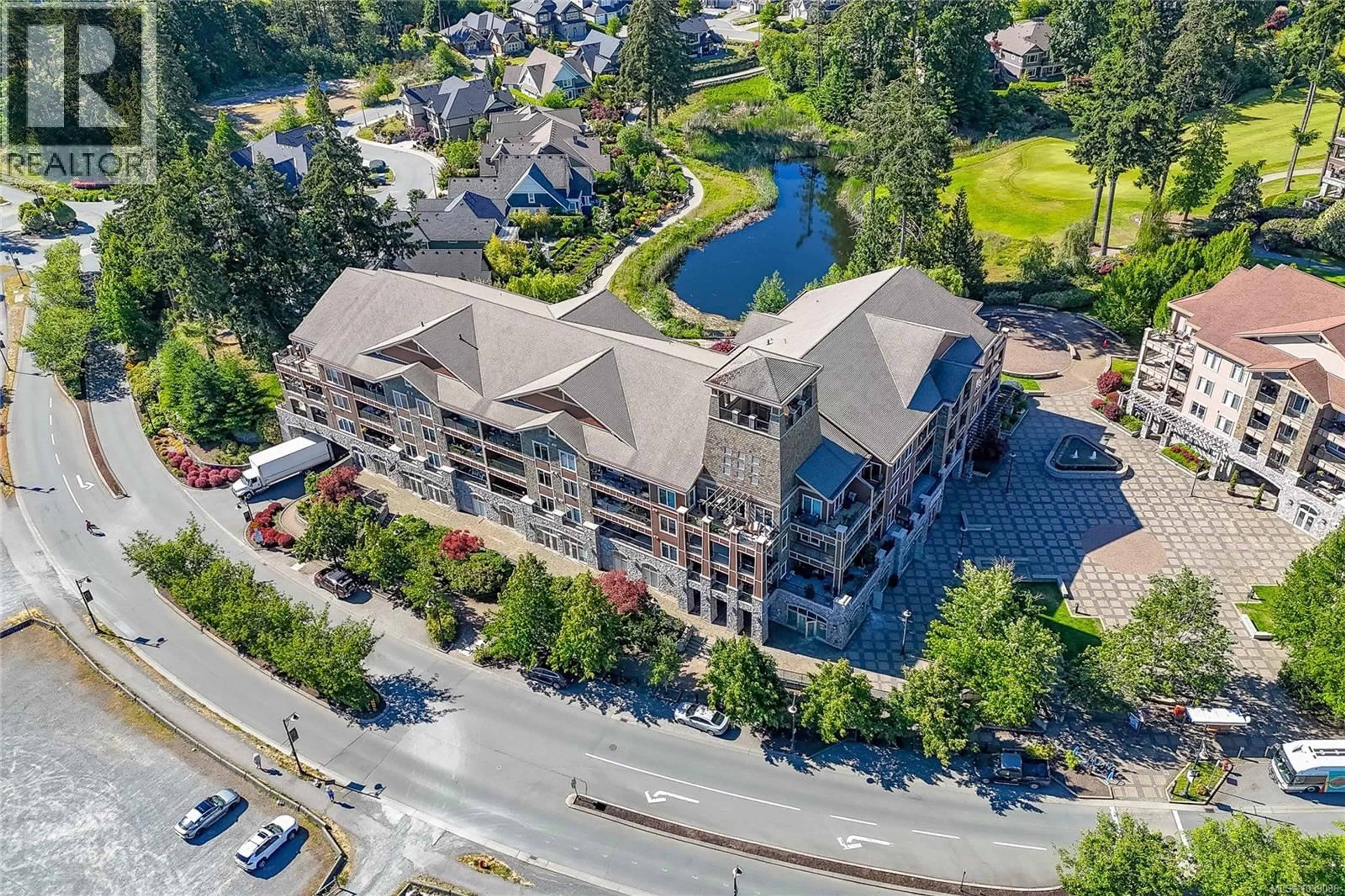 A pic from outside/outdoor area/front of a property/back of a property/a pic from drone, unknown for 215 - 1325 BEAR MOUNTAIN PARKWAY, Langford British Columbia V9B6T8