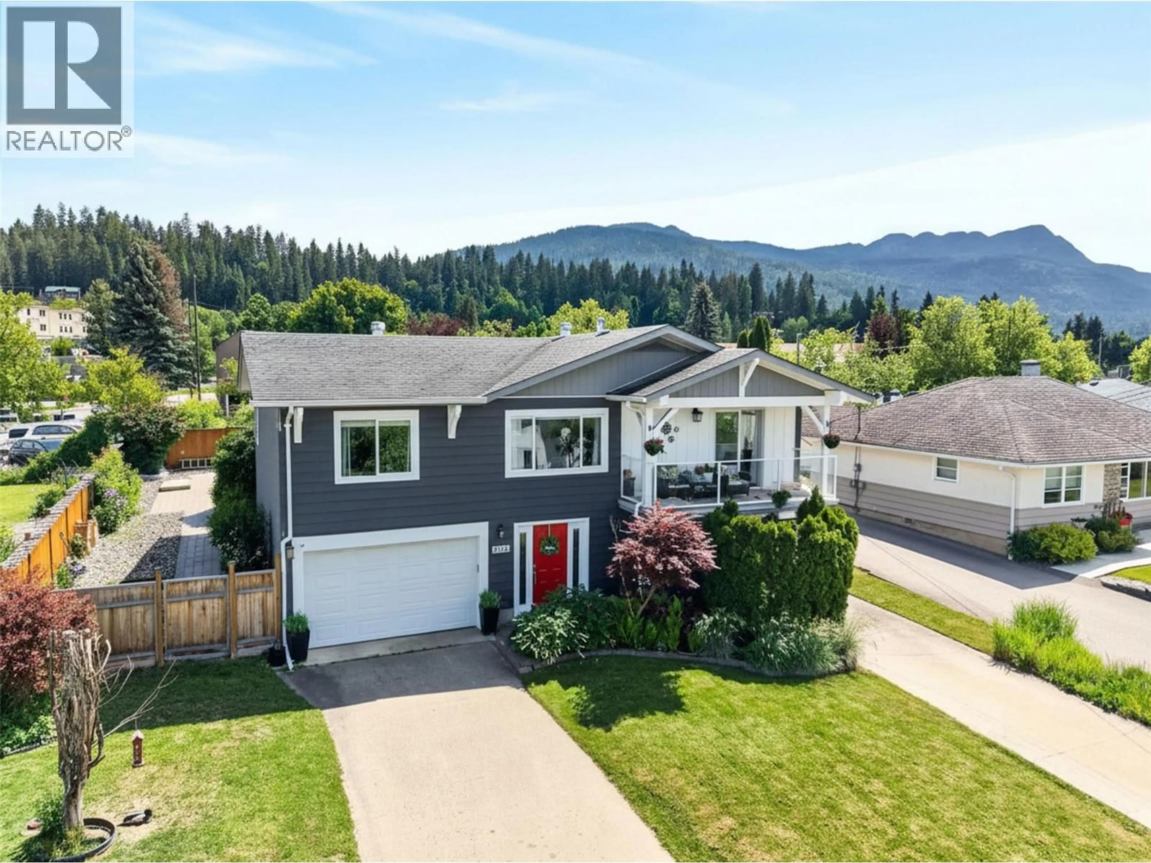 A pic from outside/outdoor area/front of a property/back of a property/a pic from drone, mountain view for 1050 8 AVENUE NORTHEAST, Salmon Arm British Columbia V1E4A4
