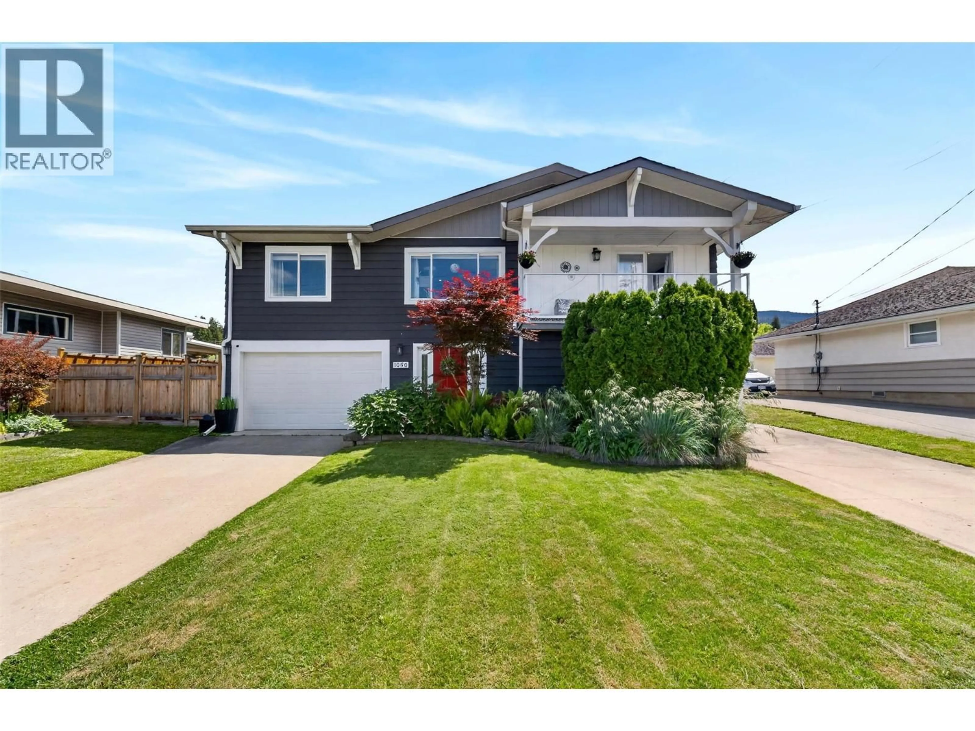 Home with vinyl exterior material, street for 1050 8 AVENUE NORTHEAST, Salmon Arm British Columbia V1E4A4