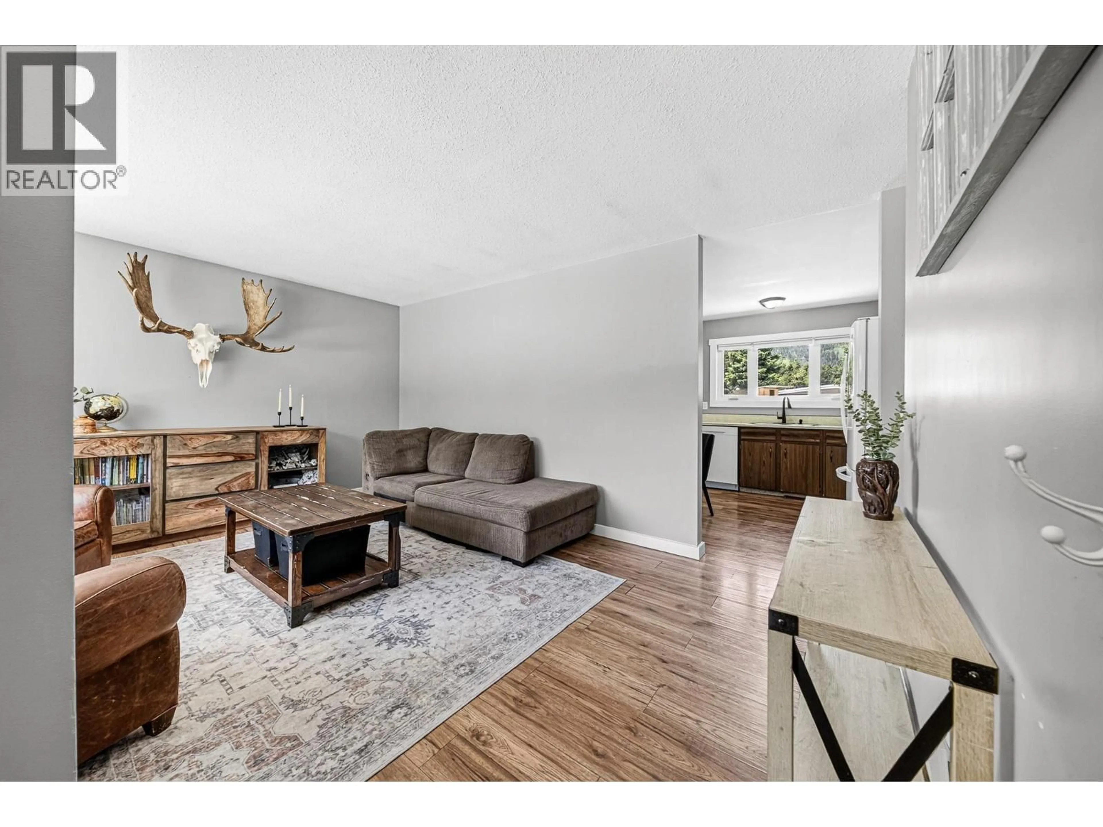 Living room with furniture, wood/laminate floor for 471 ENGELMANN SPRUCE DRIVE, Sparwood British Columbia V0B2G0