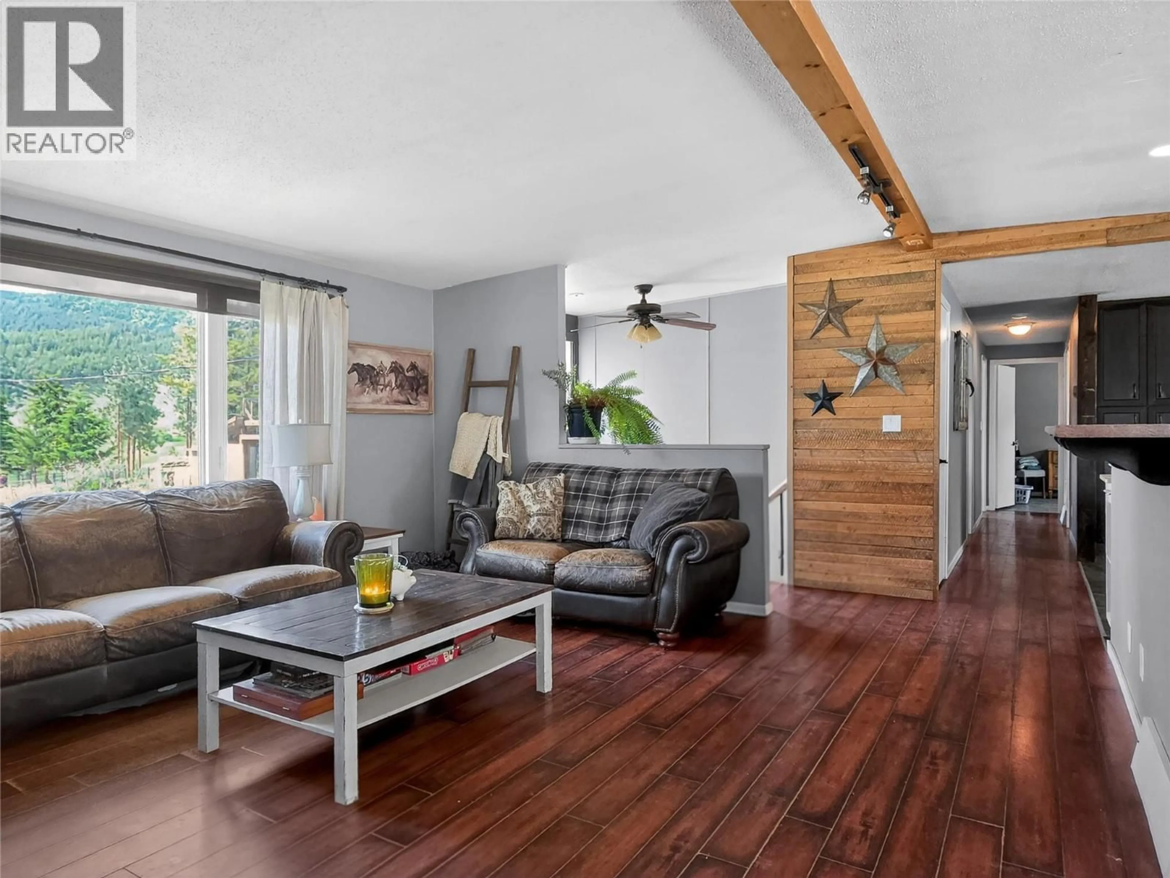 Living room with furniture, wood/laminate floor for 1497 WATSON LARSON ROAD, Kamloops British Columbia V2C6Y1