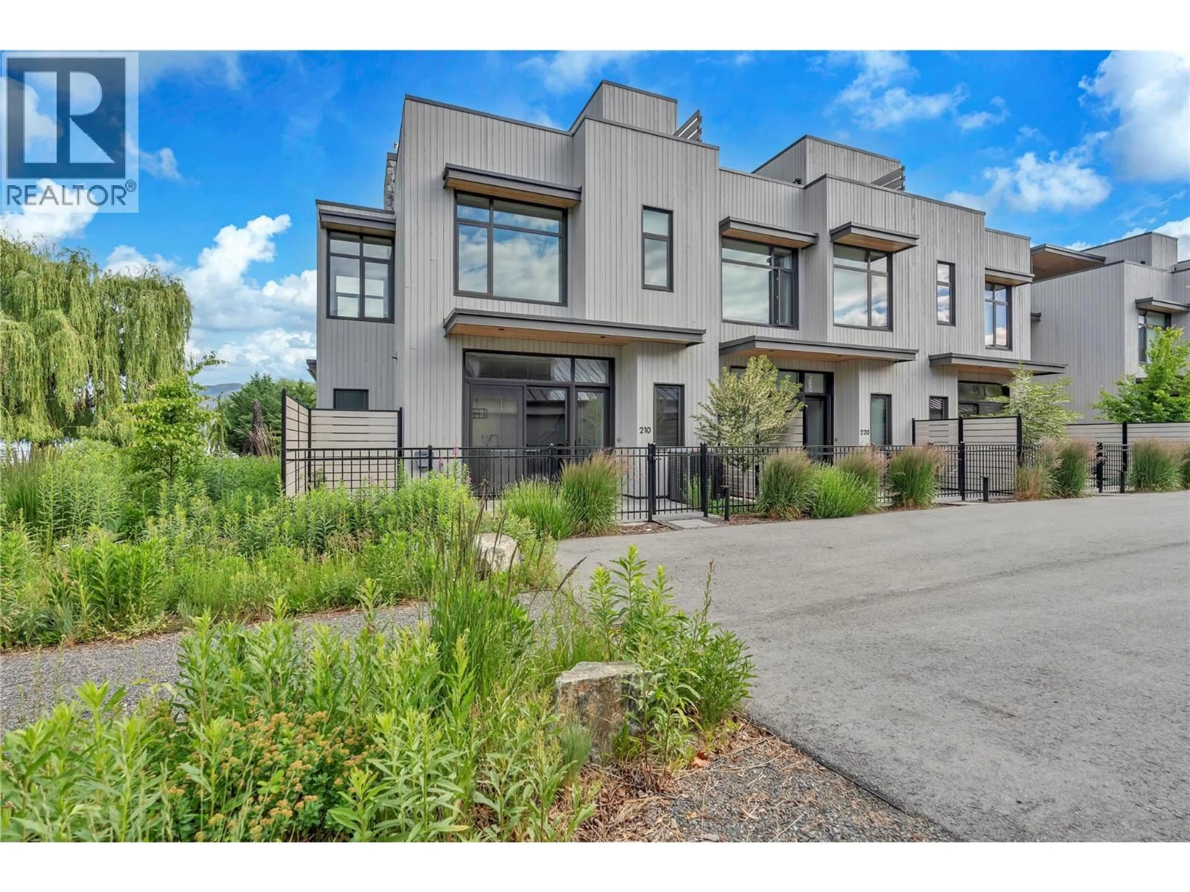 Home with brick exterior material, street for 210 ANNA AVENUE, Naramata British Columbia V0H1N1