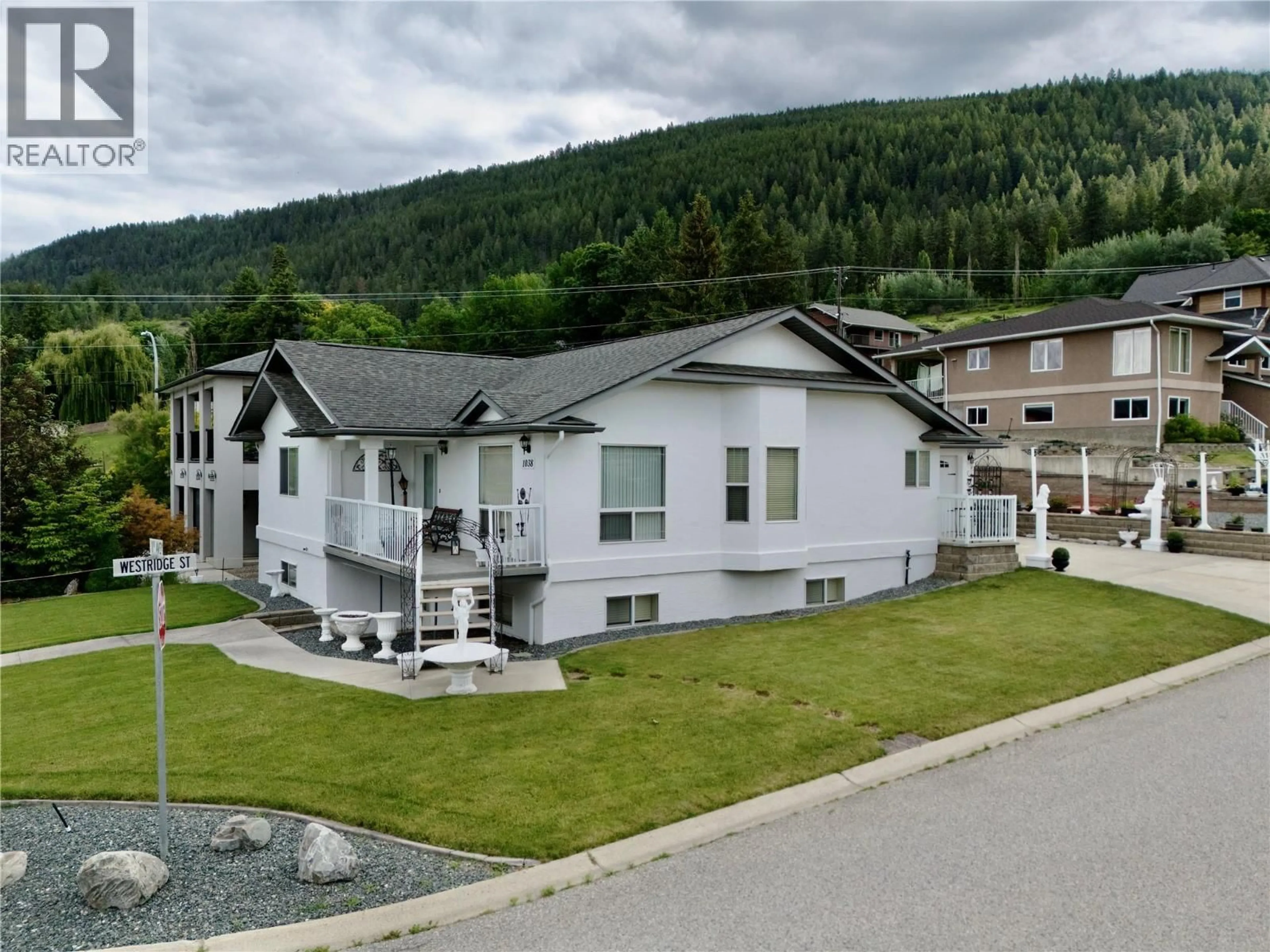 A pic from outside/outdoor area/front of a property/back of a property/a pic from drone, mountain view for 1038 11TH AVENUE NORTH, Creston British Columbia V0B1G6