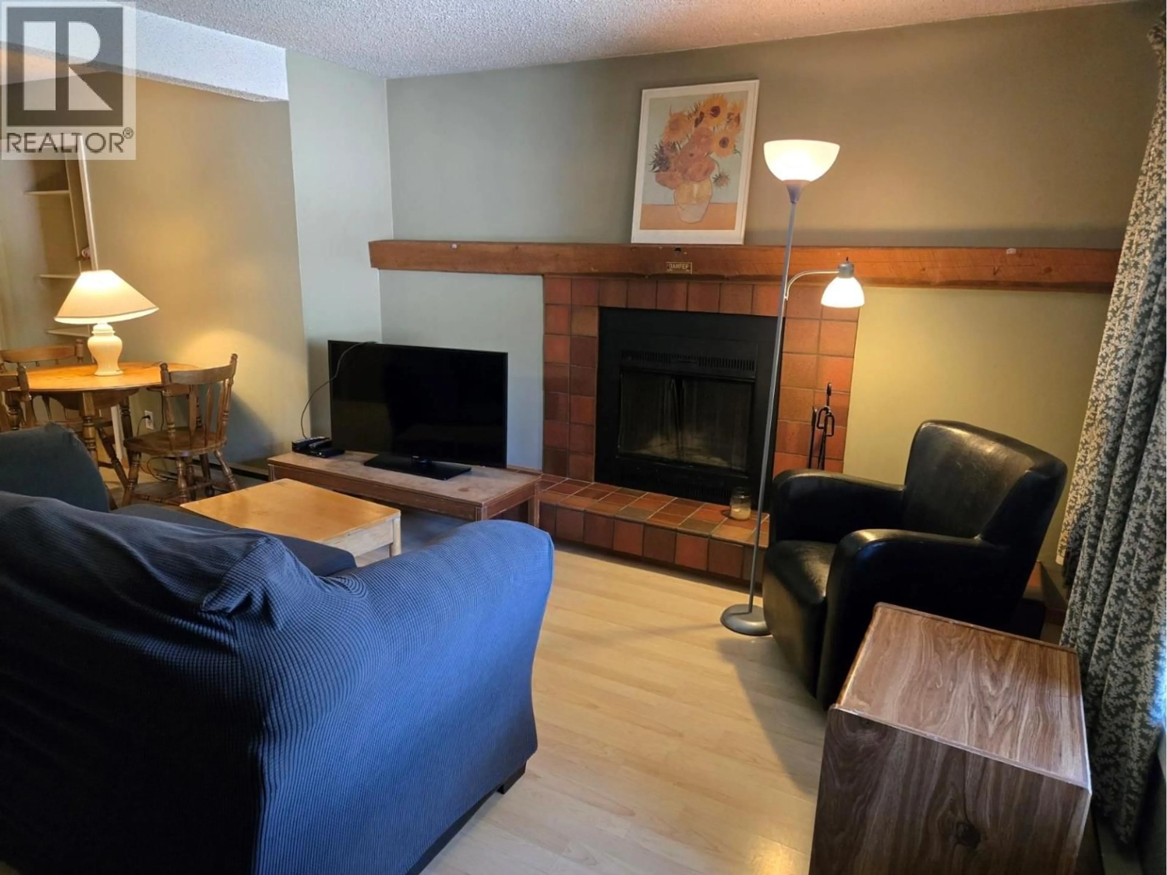 Living room with furniture, wood/laminate floor for 506 - 2030 PANORAMA DRIVE, Panorama British Columbia V0A1T0