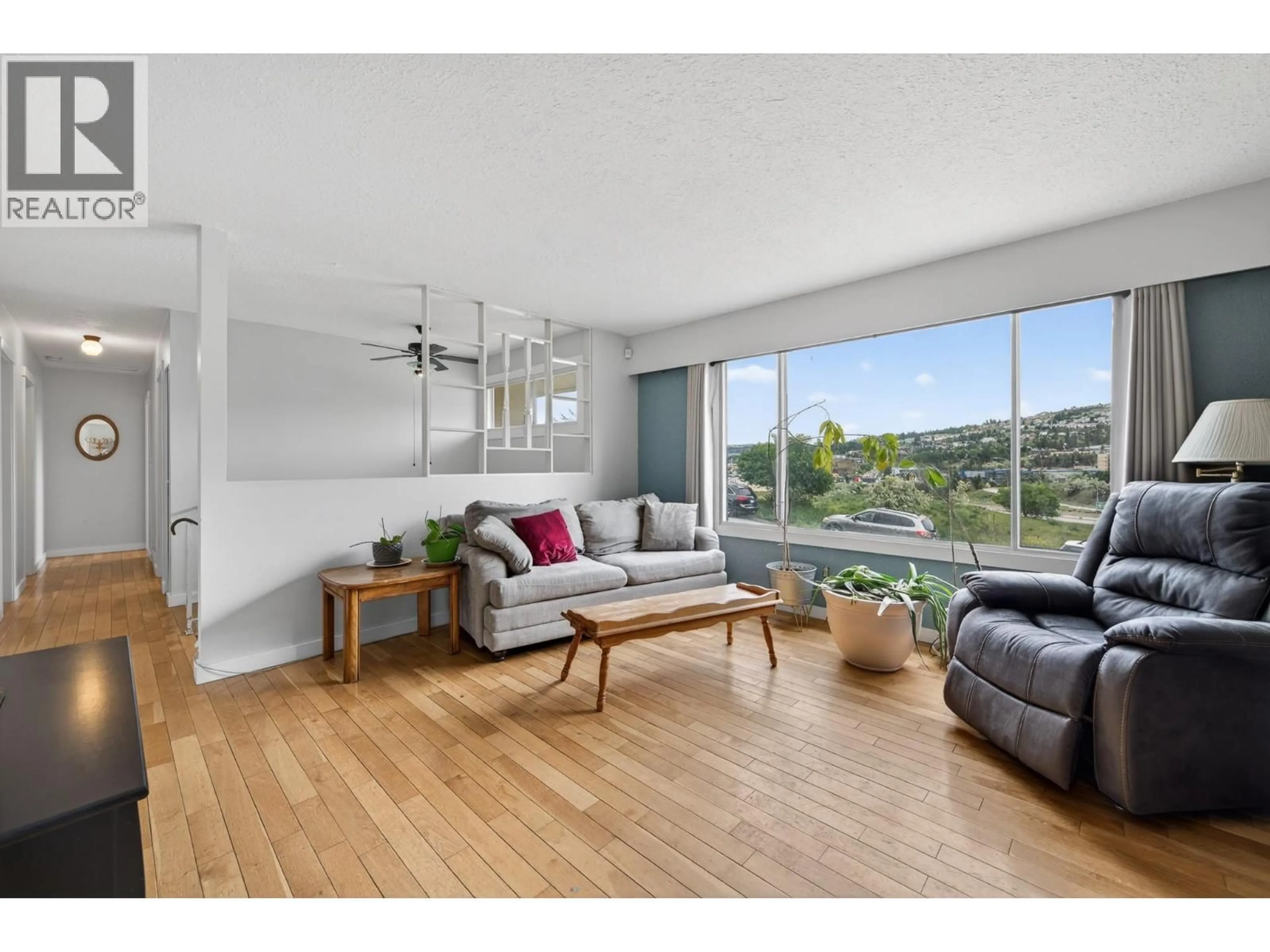 Living room with furniture, wood/laminate floor for 1514 CASCADE STREET, Kamloops British Columbia V2E1B9