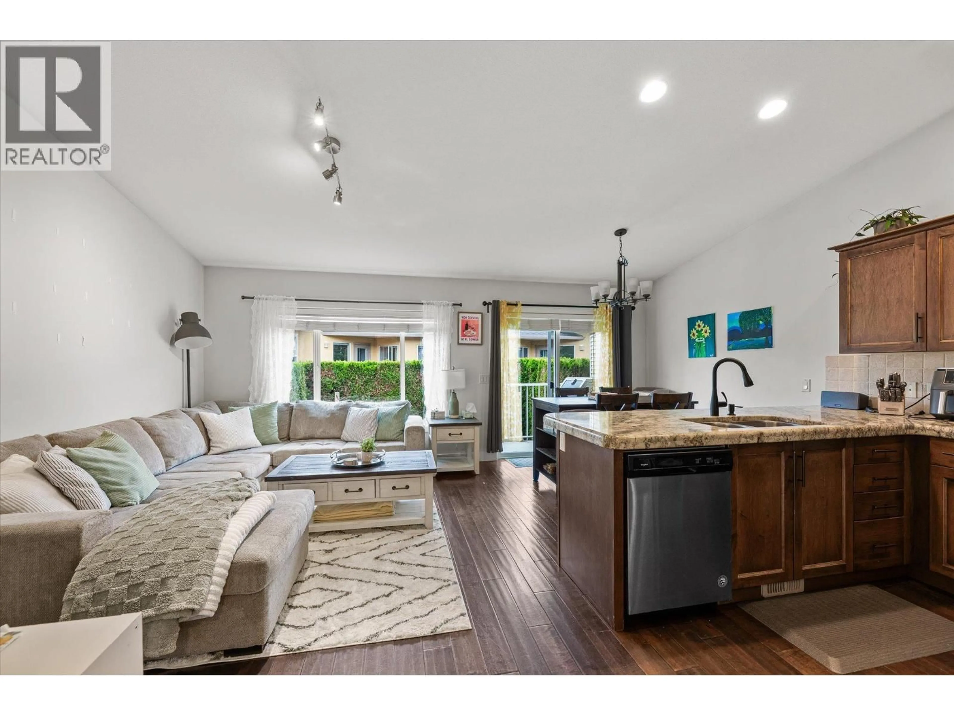 Open concept kitchen, wood/laminate floor for 7 - 225 GLEN PARK DRIVE, Kelowna British Columbia V1V2X5
