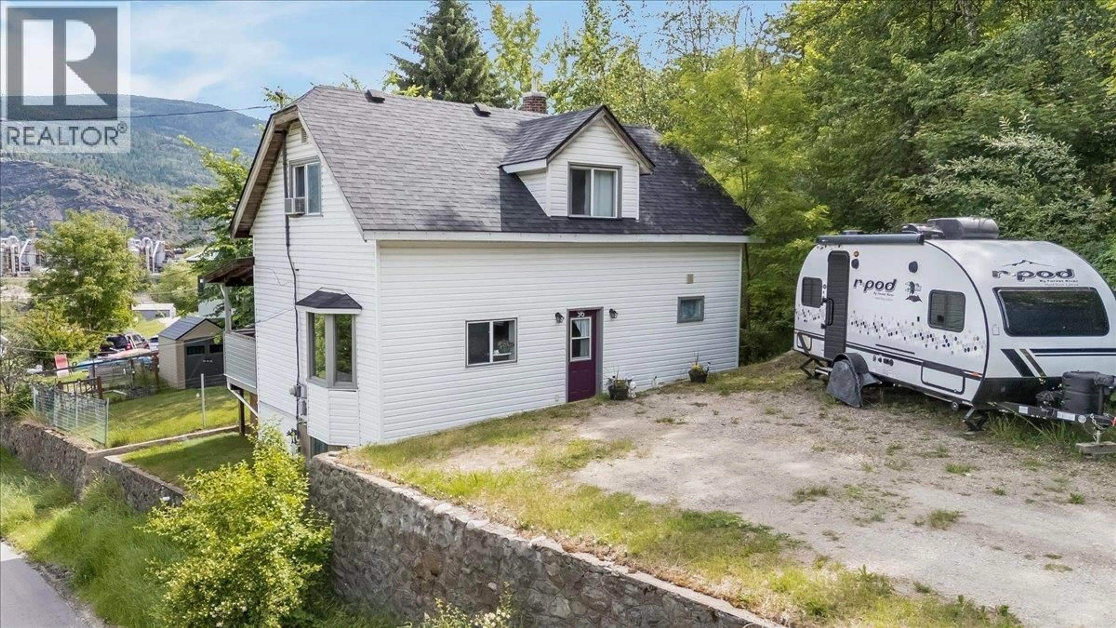 A pic from outside/outdoor area/front of a property/back of a property/a pic from drone, street for 96 RESERVOIR ROAD, Warfield British Columbia V1R3R8