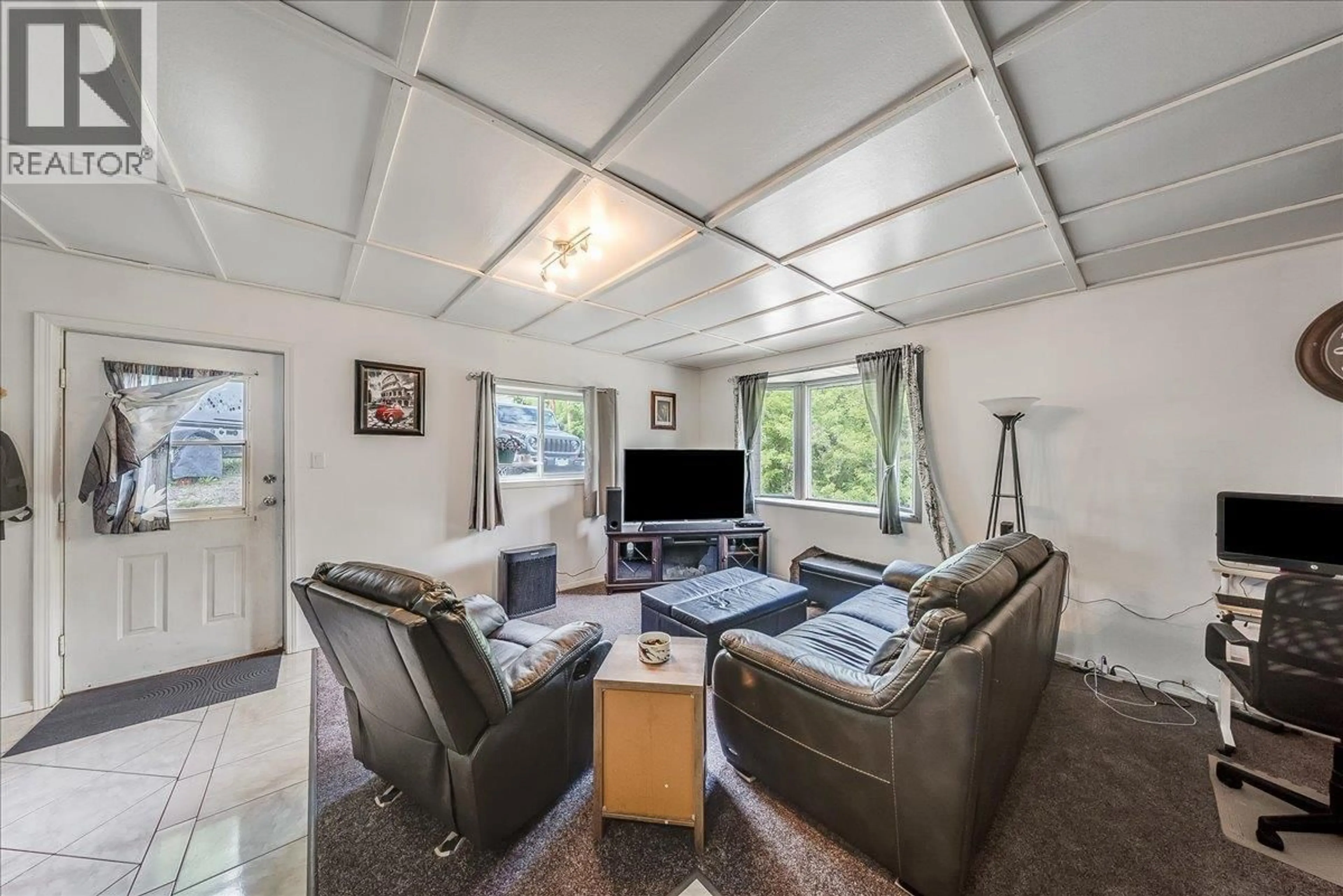 Living room with furniture, unknown for 96 RESERVOIR ROAD, Warfield British Columbia V1R3R8
