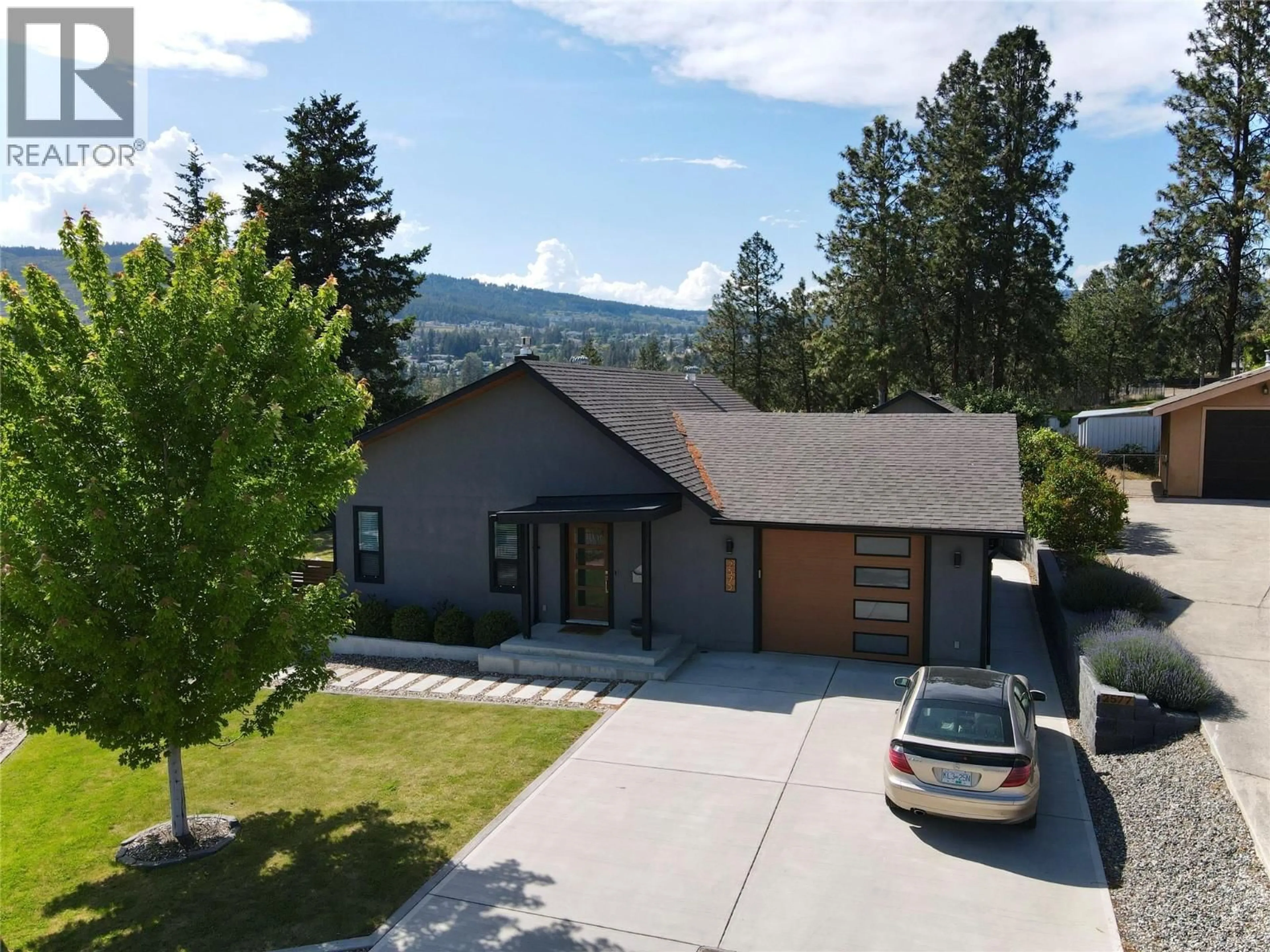 A pic from outside/outdoor area/front of a property/back of a property/a pic from drone, mountain view for 2575 PINERIDGE PLACE, West Kelowna British Columbia V4T2J7