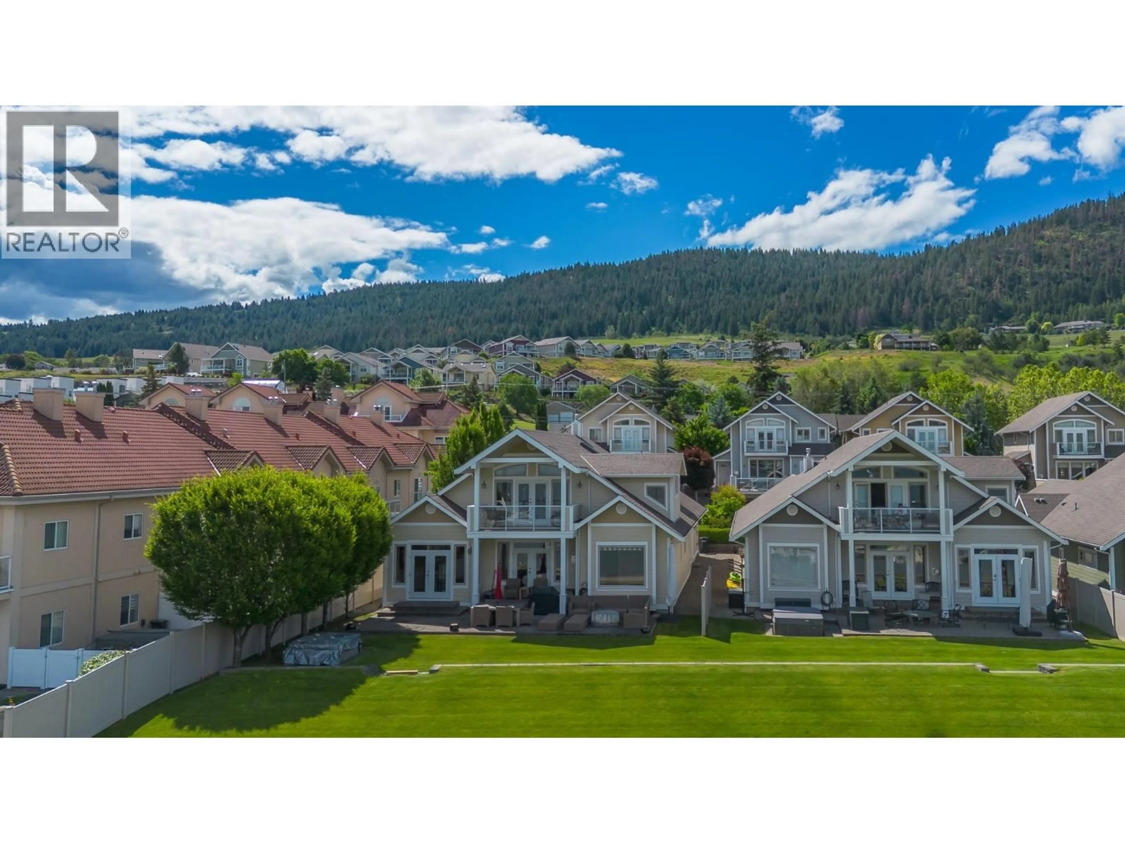A pic from outside/outdoor area/front of a property/back of a property/a pic from drone, mountain view for 7 - 7769 OKANAGAN LANDING ROAD, Vernon British Columbia V1H1V9