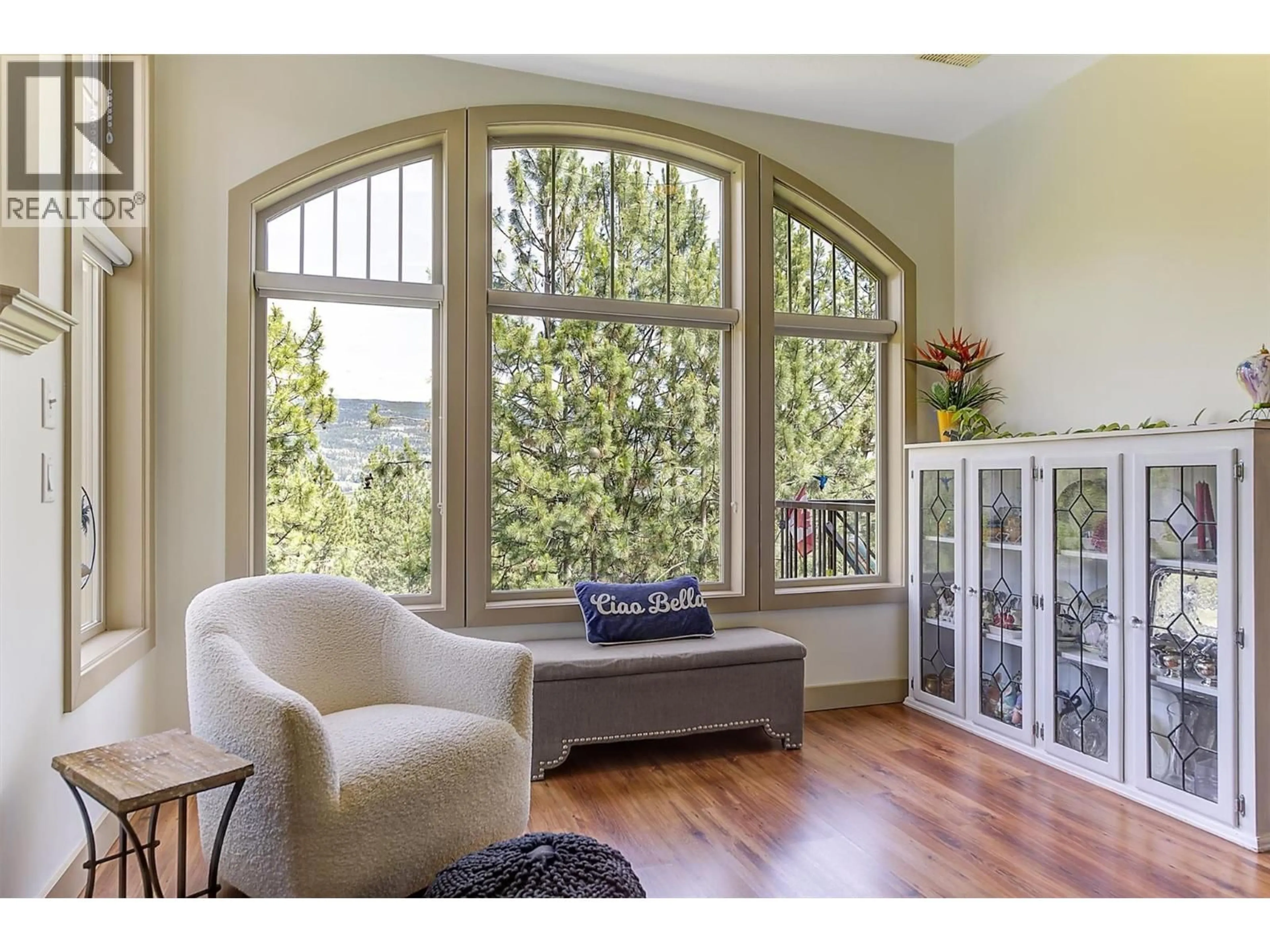 Living room with furniture, wood/laminate floor for 206 - 1795 COUNTRY CLUB ROAD, Kelowna British Columbia V1V2V9