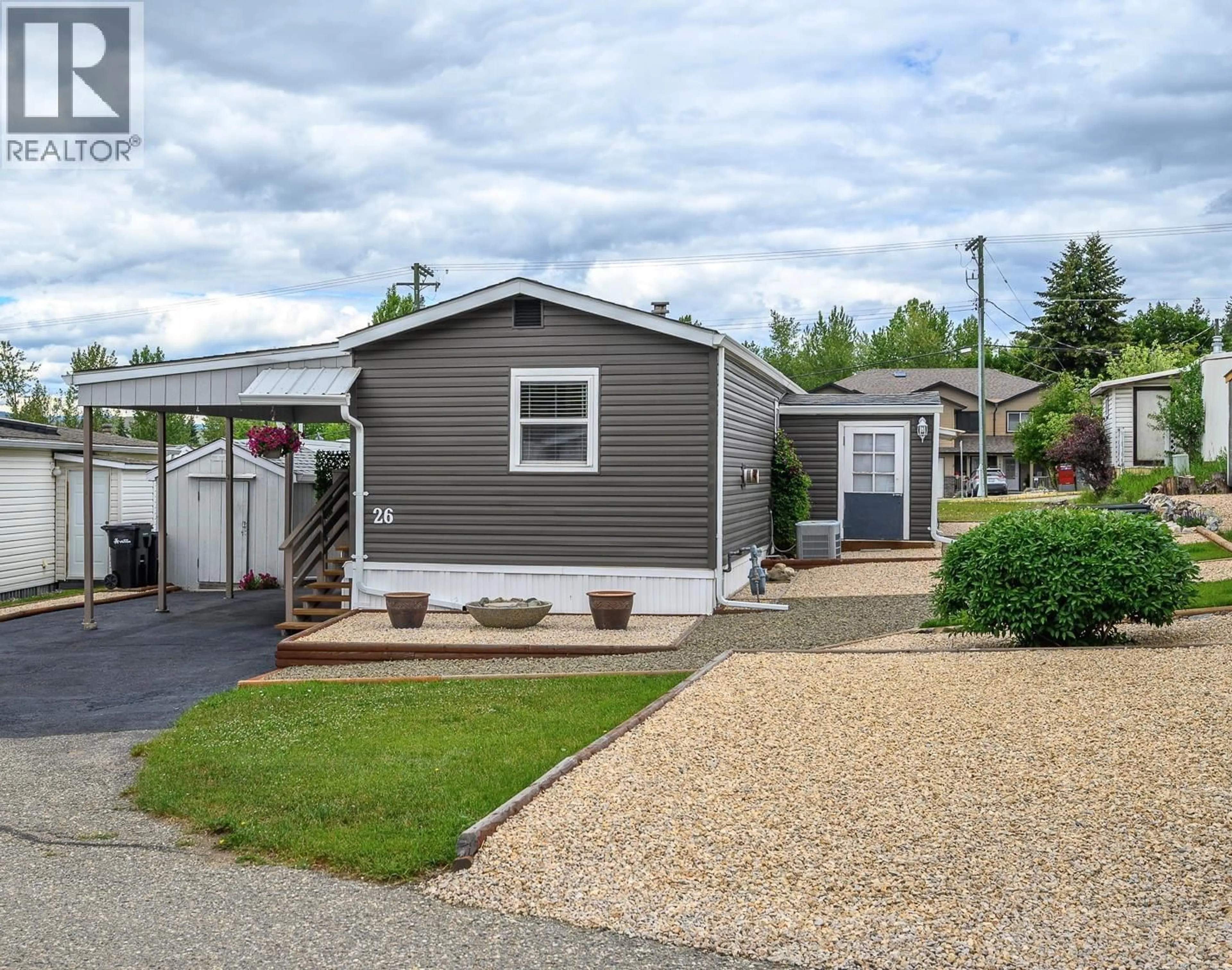 Home with vinyl exterior material, street for 26 - 1600 43 AVENUE, Vernon British Columbia V1T9G6