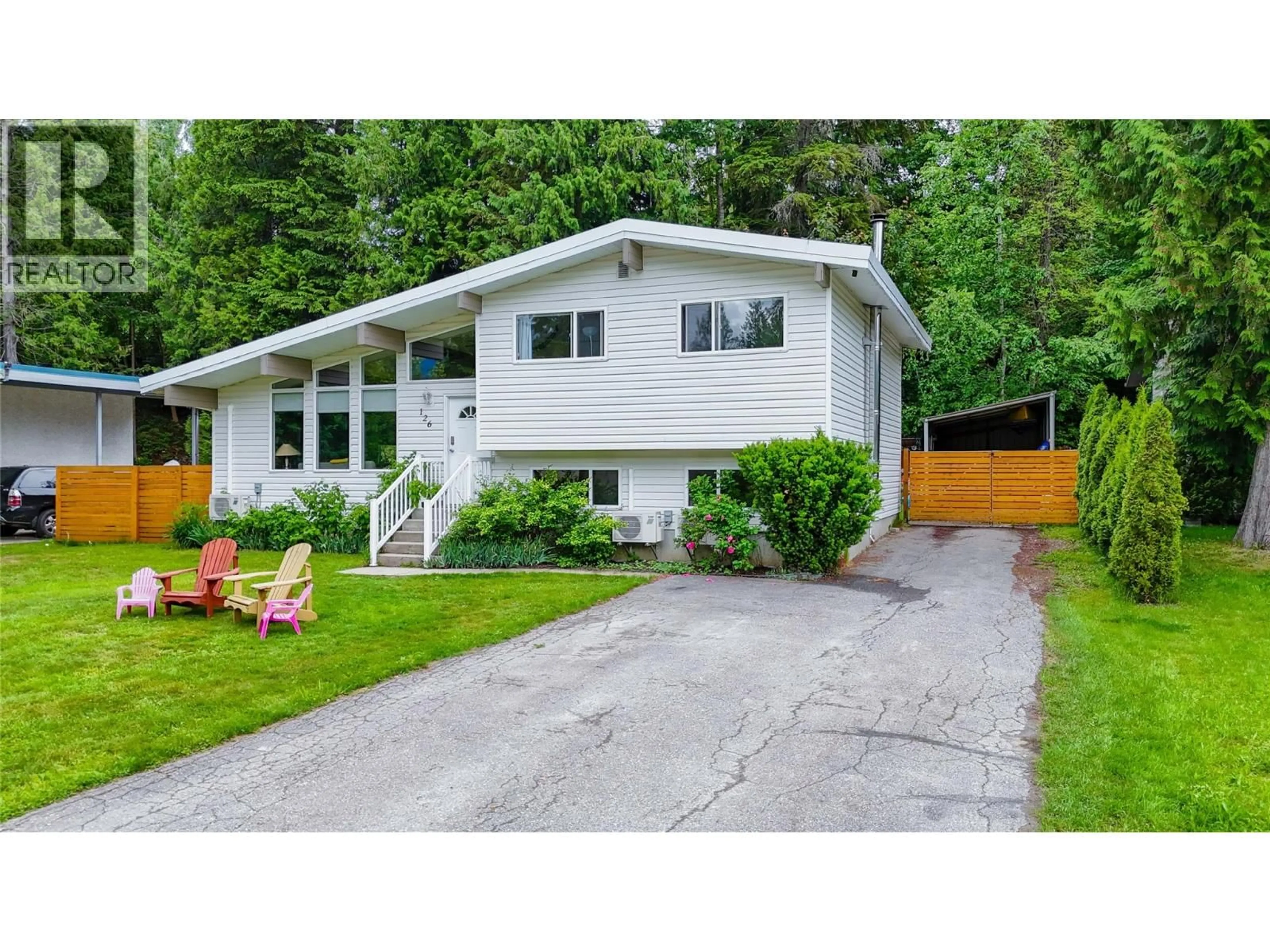 Home with vinyl exterior material, street for 126 BERNARD NELSON CRESCENT, Revelstoke British Columbia V0E2S0