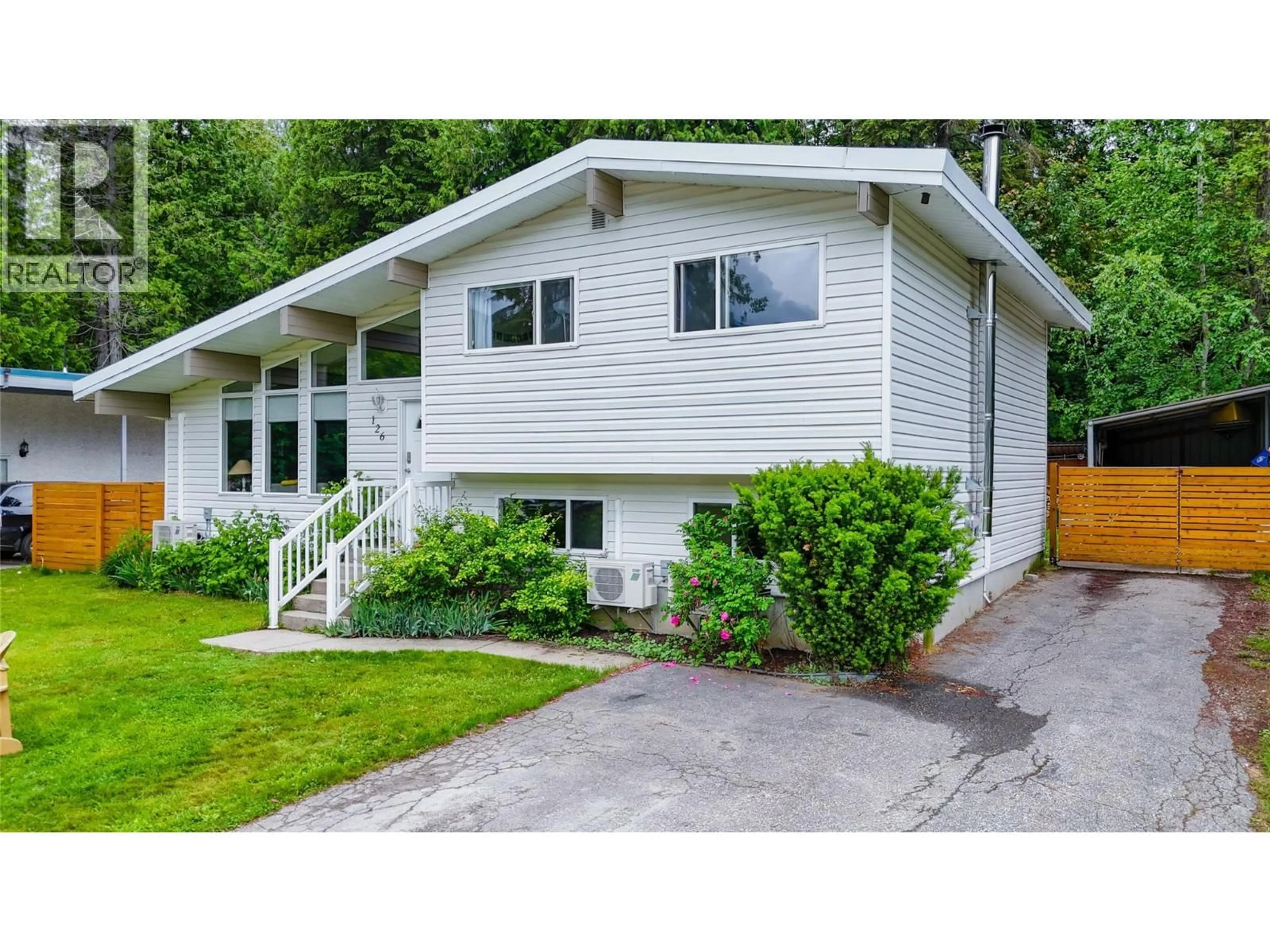 Home with vinyl exterior material, street for 126 BERNARD NELSON CRESCENT, Revelstoke British Columbia V0E2S0