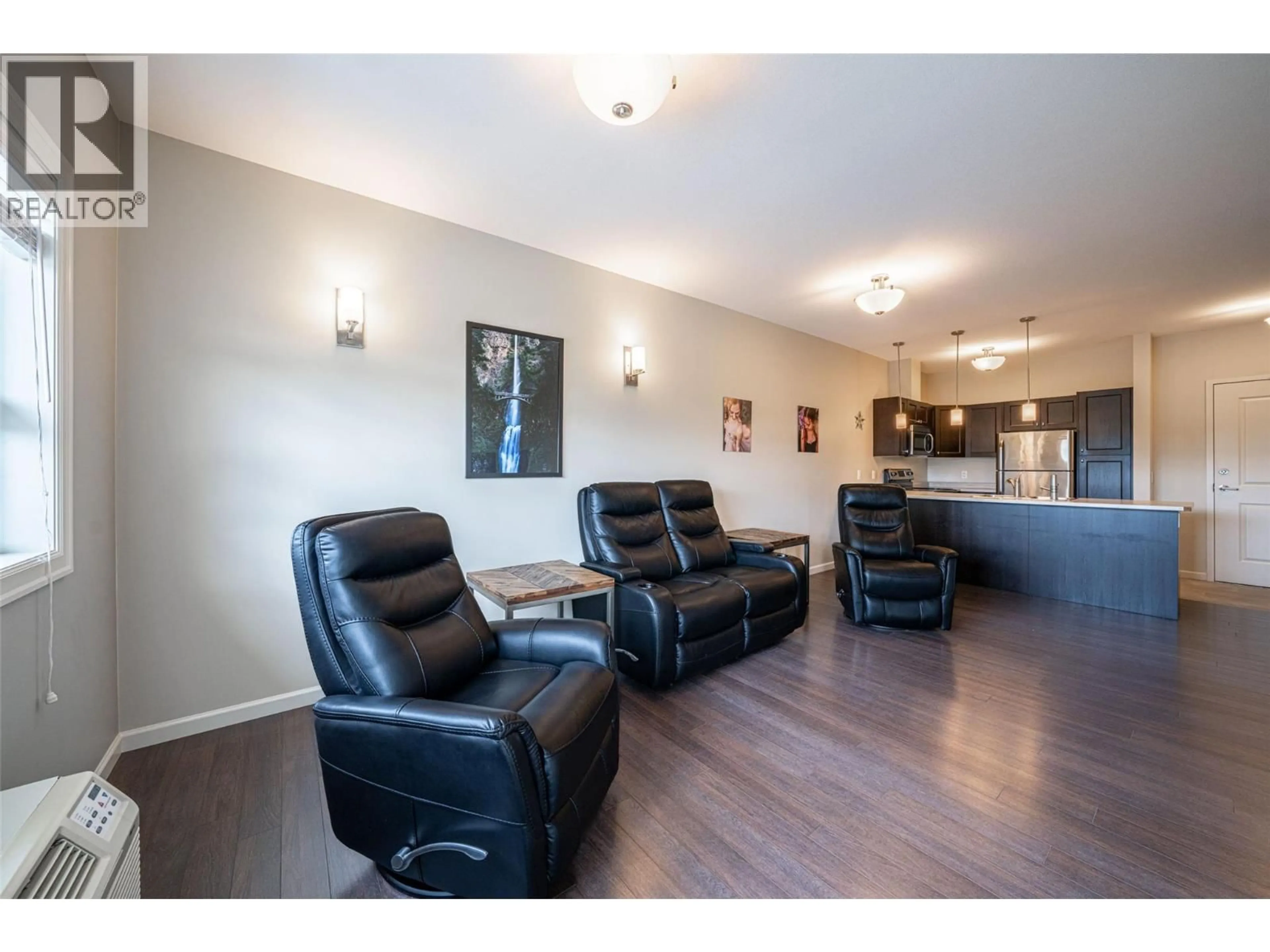 Living room with furniture, wood/laminate floor for 414 - 3010 35TH STREET, Vernon British Columbia V1T0A7
