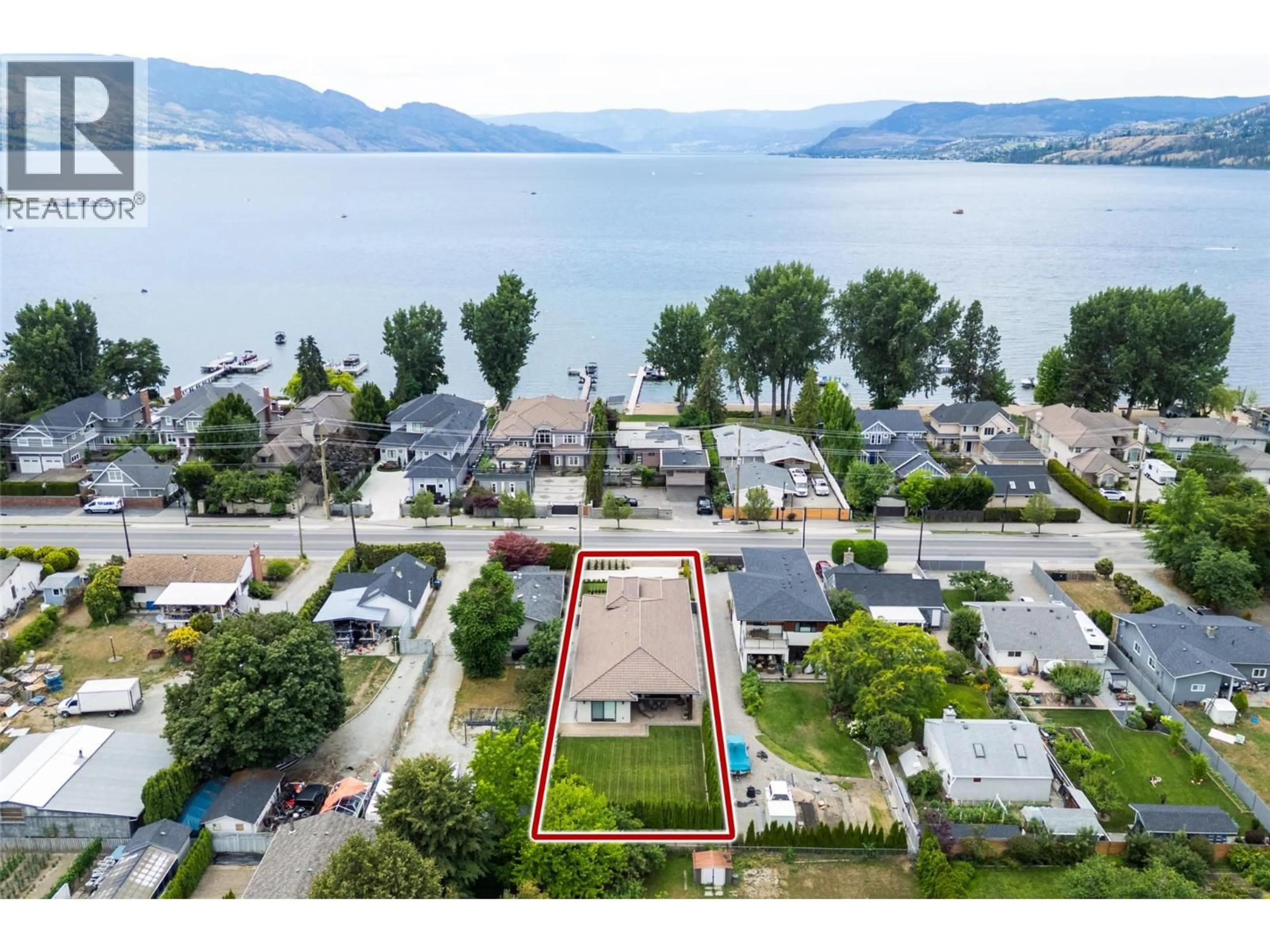 A pic from outside/outdoor area/front of a property/back of a property/a pic from drone, water/lake/river/ocean view for 3567 LAKESHORE ROAD, Kelowna British Columbia V1W3K1
