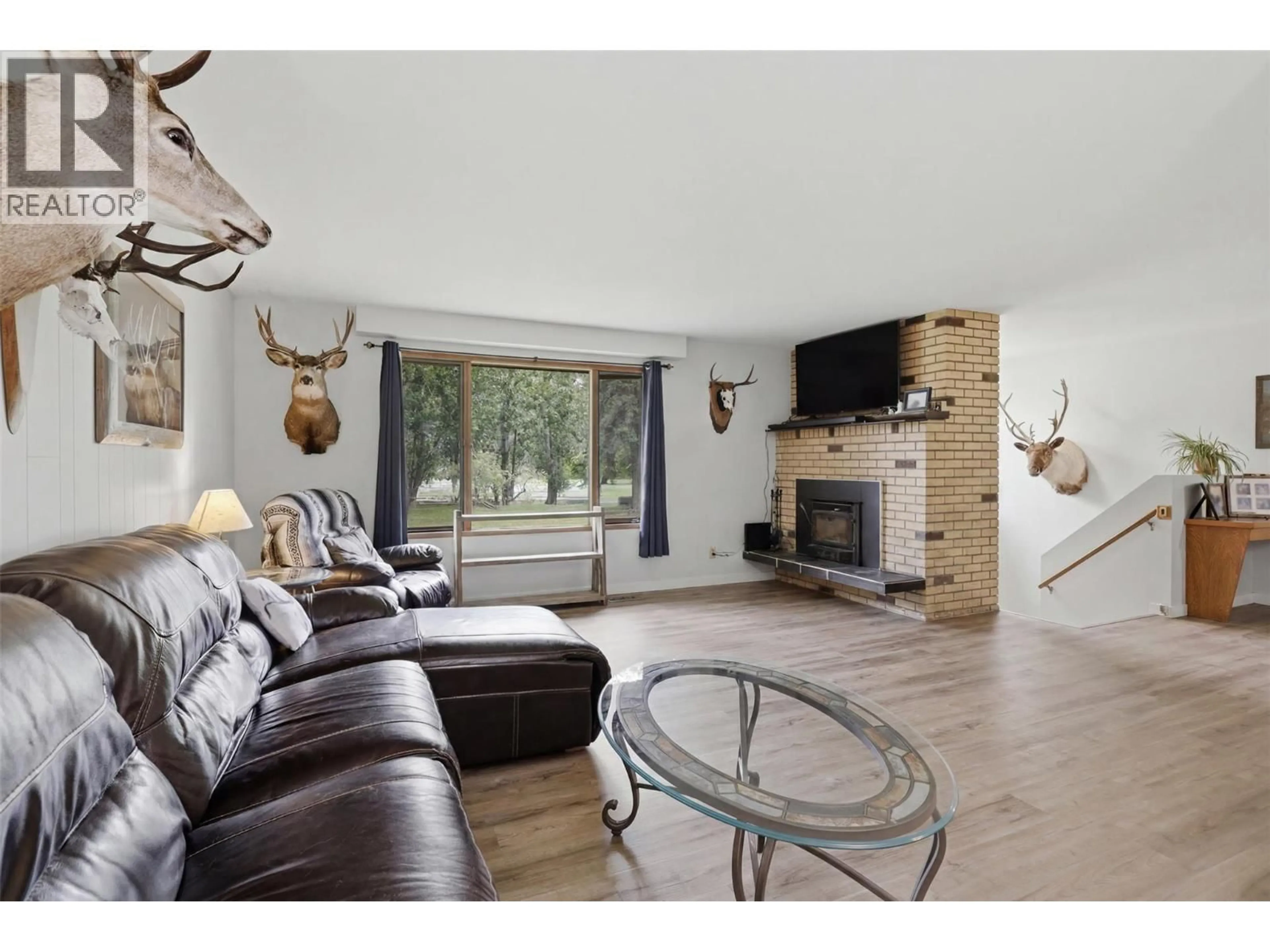 Living room with furniture, wood/laminate floor for 216 MCLURE FERRY ROAD, McLure British Columbia V0E1E0
