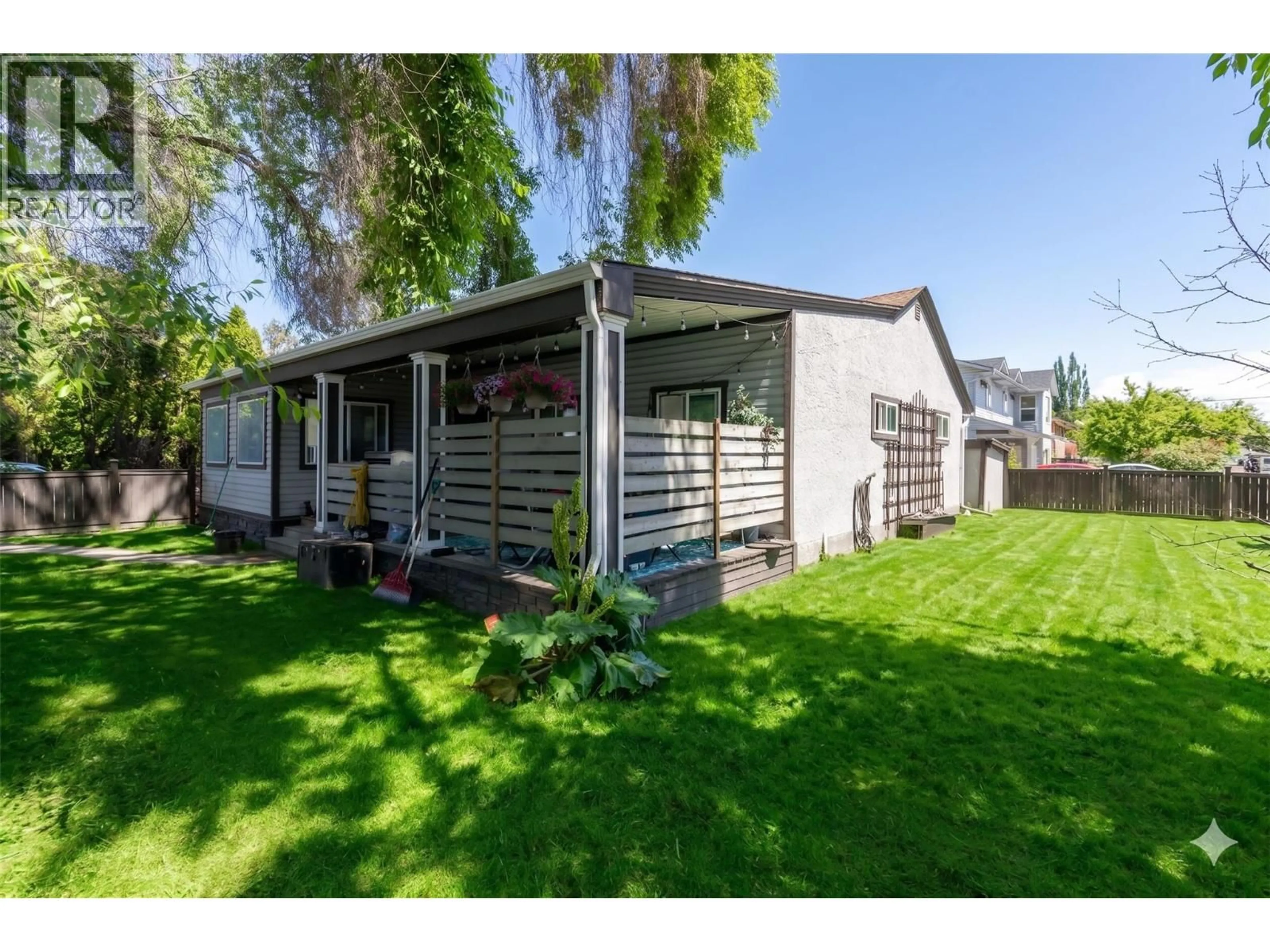 Home with vinyl exterior material, street for 2435 RICHTER STREET, Kelowna British Columbia V1Y2P5
