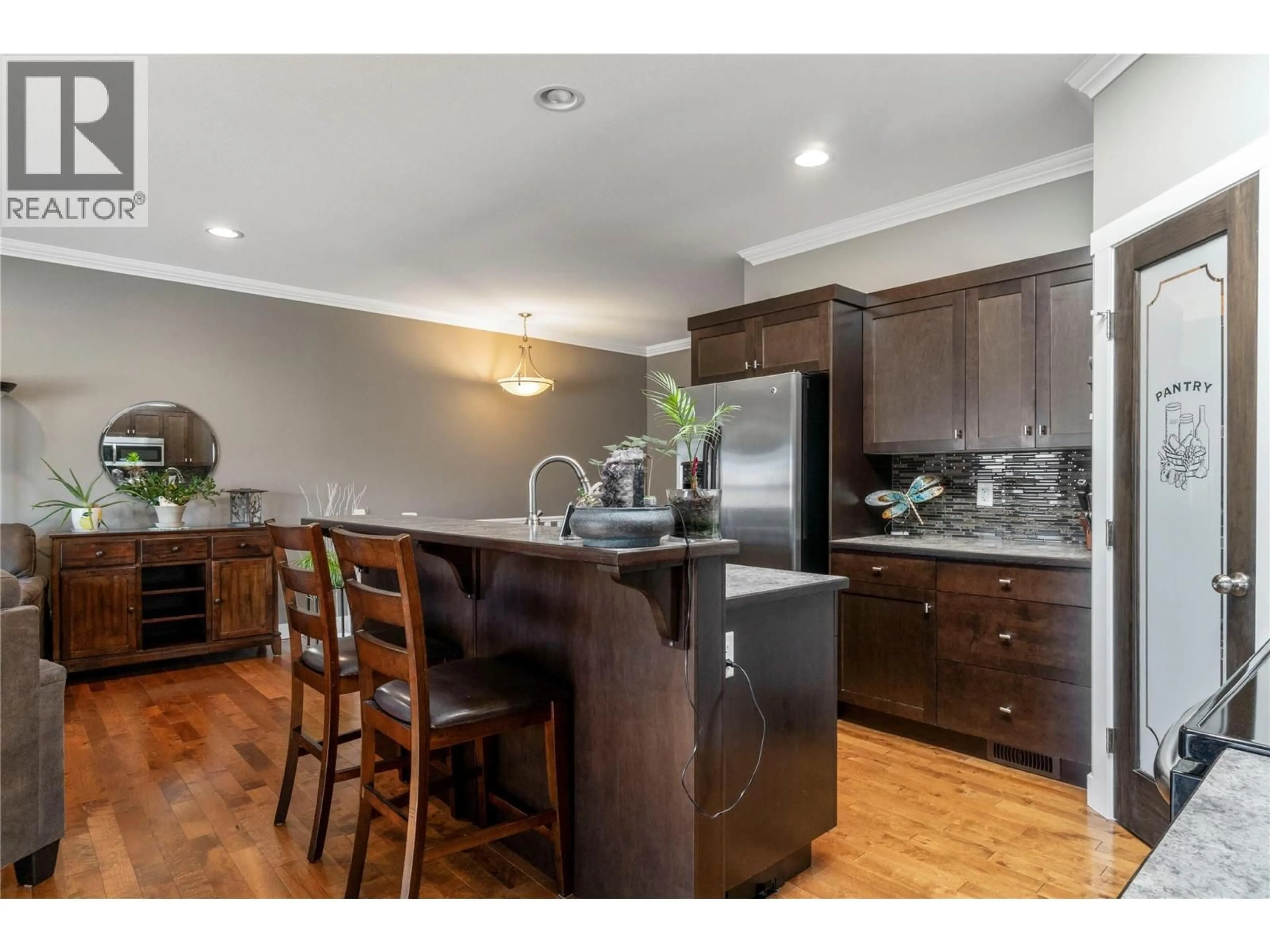 Open concept kitchen, wood/laminate floor for 24 - 2751 15 AVENUE NORTHEAST, Salmon Arm British Columbia V1E0B5