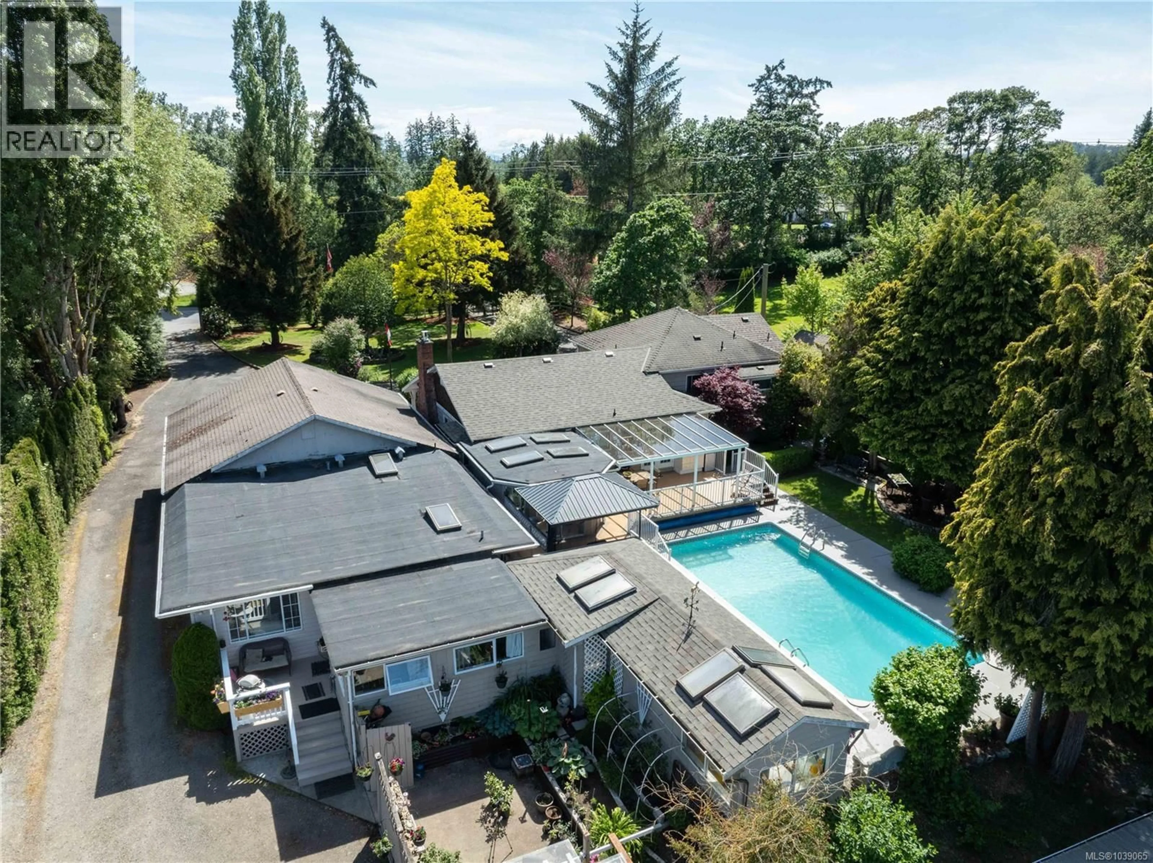 A pic from outside/outdoor area/front of a property/back of a property/a pic from drone, unknown for 1568 BURNSIDE ROAD WEST, Saanich British Columbia V9E2E2