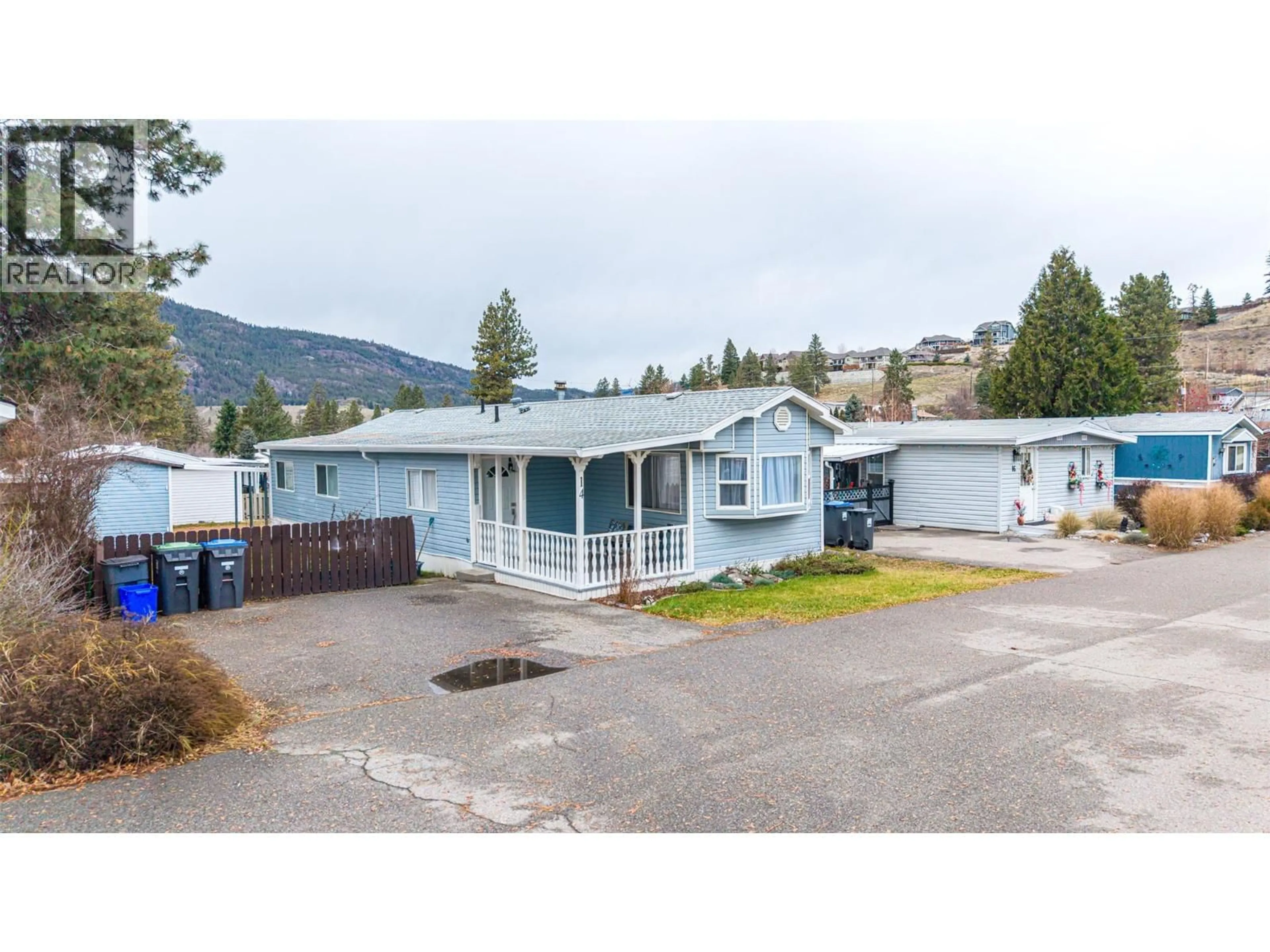 Home with vinyl exterior material, mountain view for E14 - 4505 MCLEAN CREEK ROAD, Okanagan Falls British Columbia V0H1R1