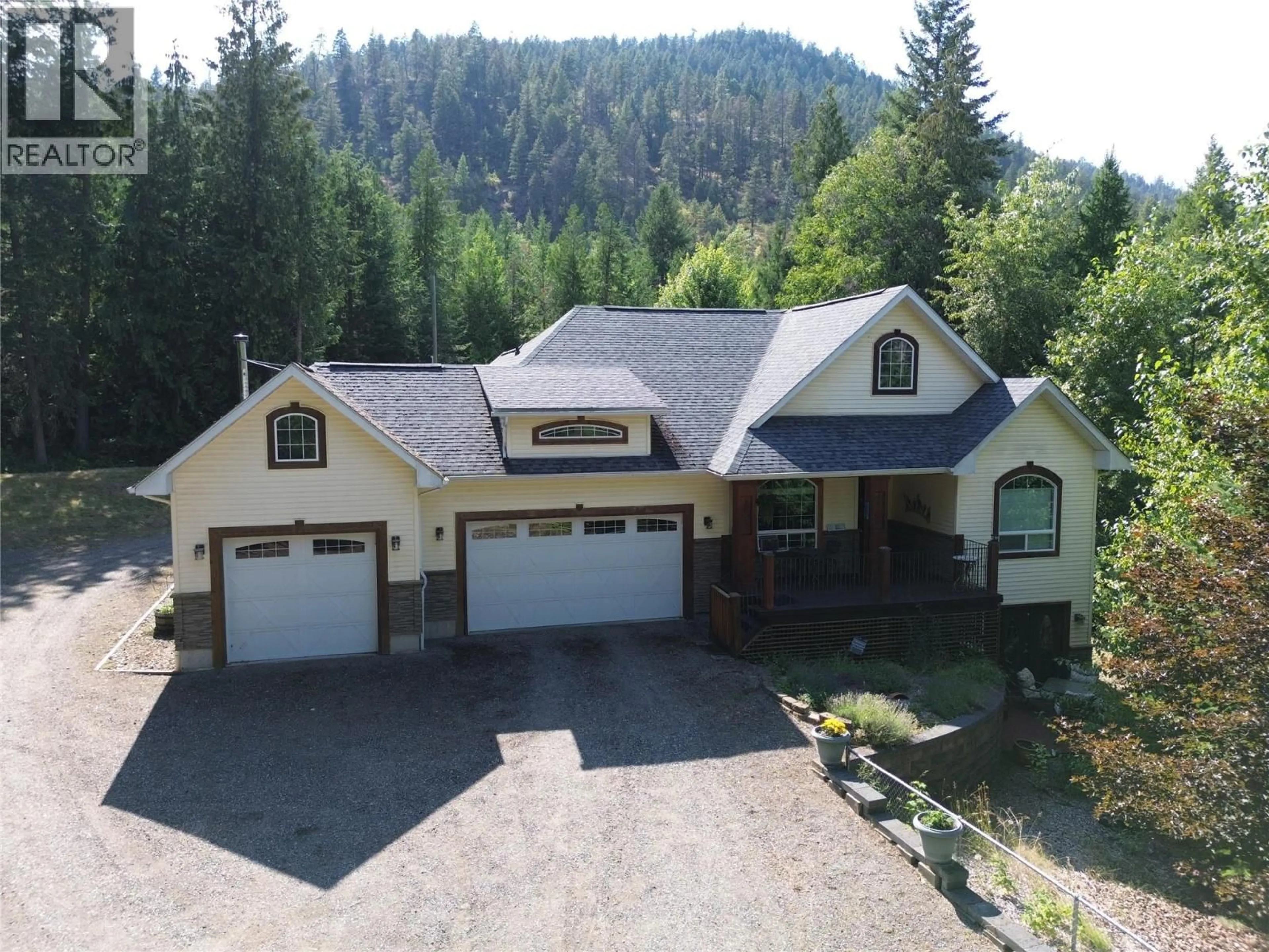 A pic from outside/outdoor area/front of a property/back of a property/a pic from drone, mountain view for 1615 BEECH ROAD, Christina Lake British Columbia V0H1E0