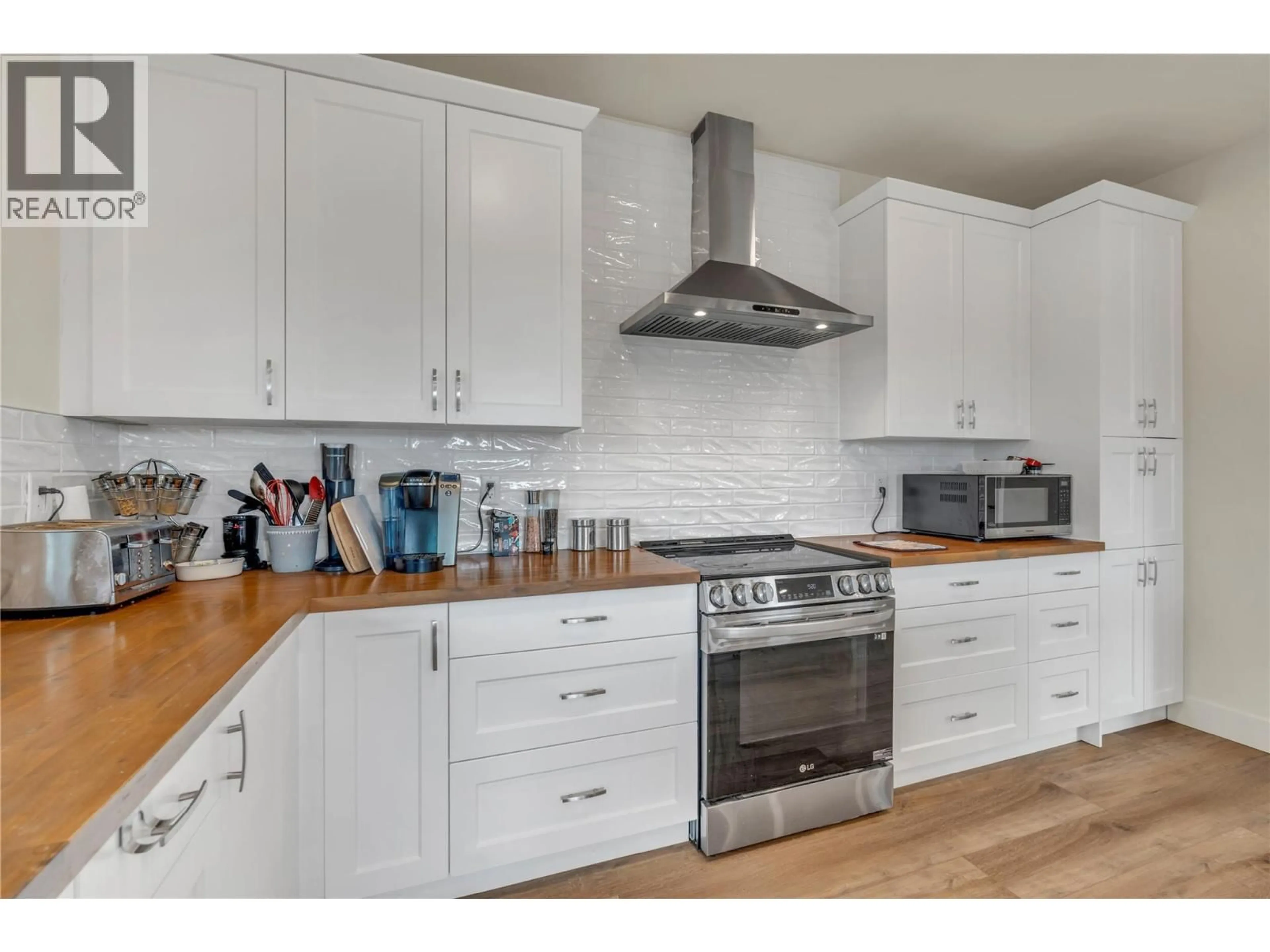 Open concept kitchen, wood/laminate floor for 318 HIDDEN VALLEY ROAD, Princeton British Columbia V0X1W0