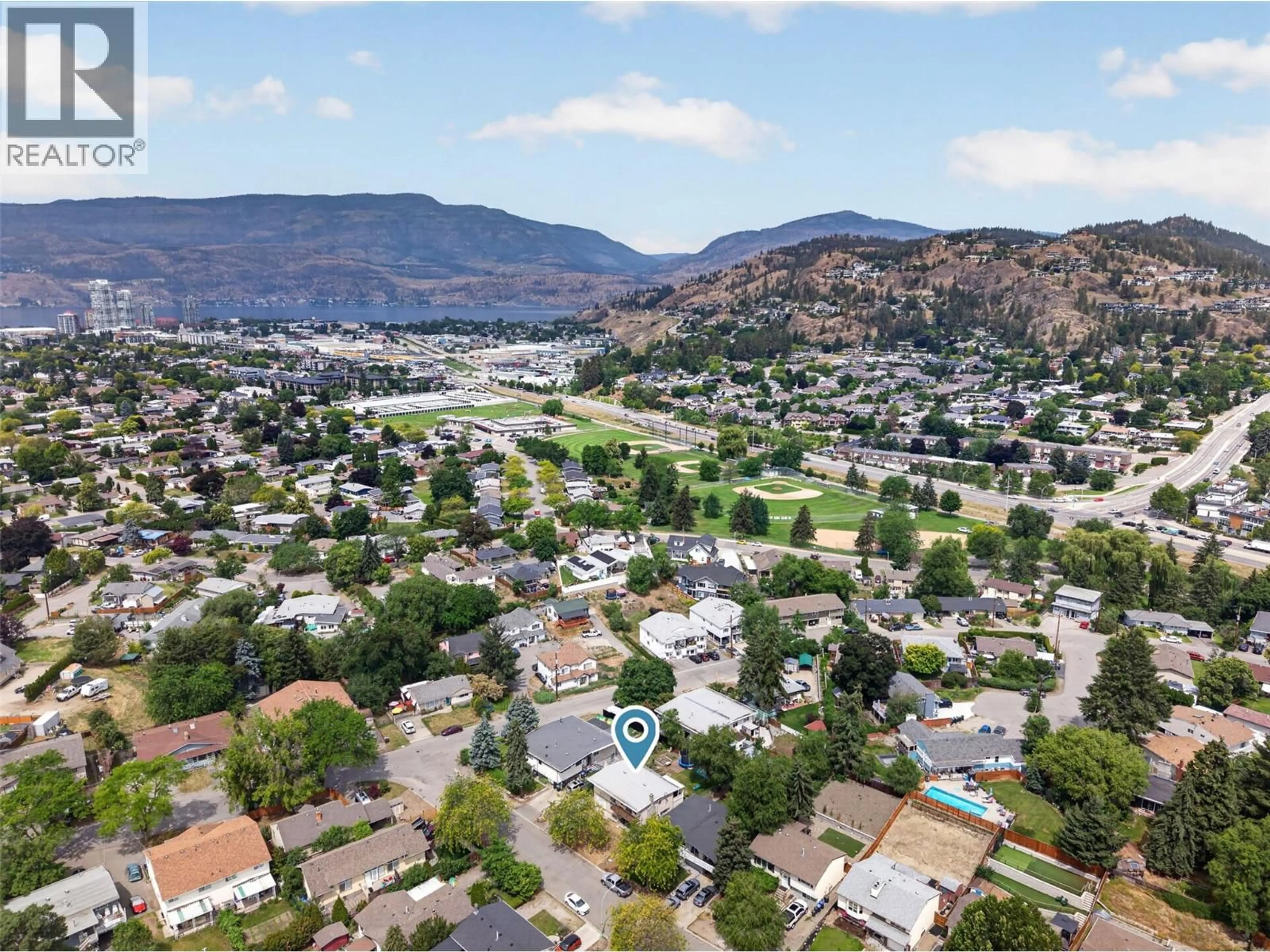 A pic from outside/outdoor area/front of a property/back of a property/a pic from drone, mountain view for 1480 LEASIDE AVENUE, Kelowna British Columbia V1Y3X5