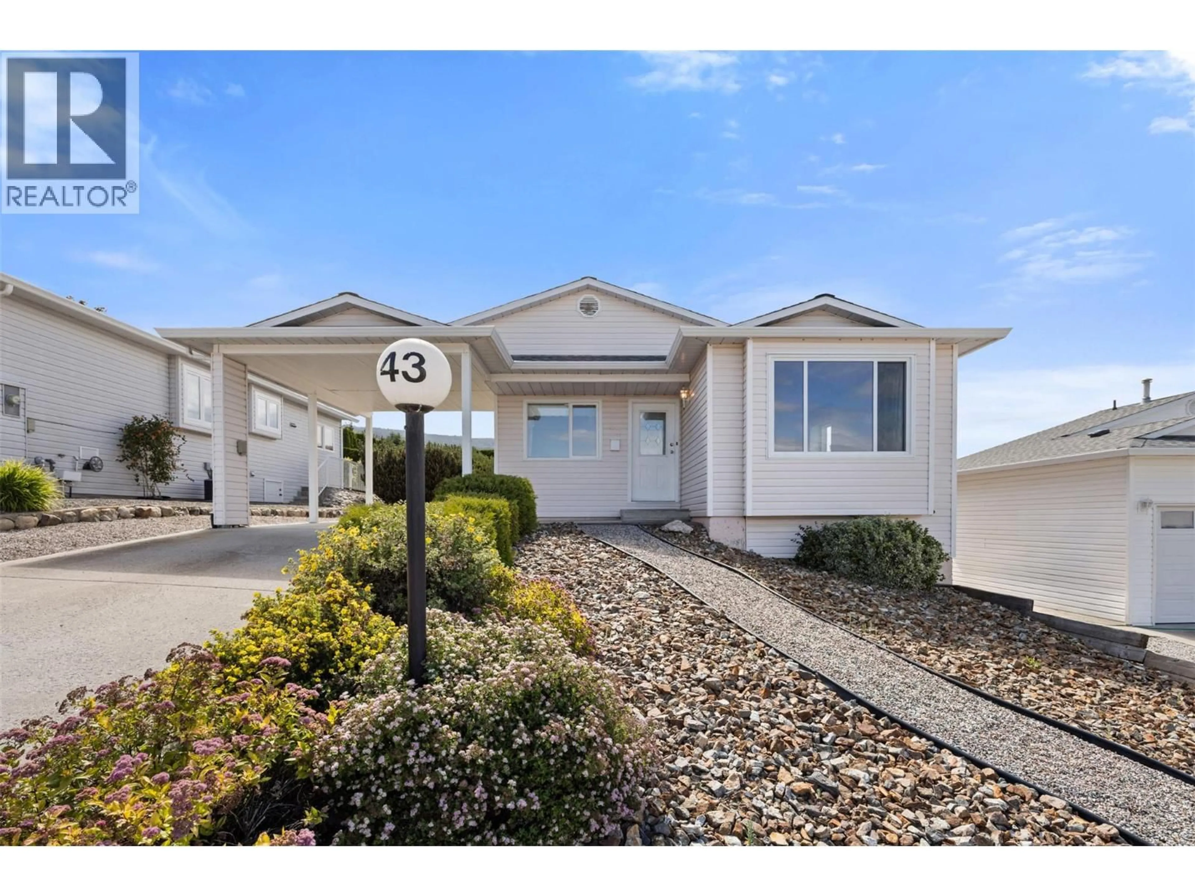 Home with vinyl exterior material, street for 43 - 6400 SPENCER ROAD, Kelowna British Columbia V1X7T6