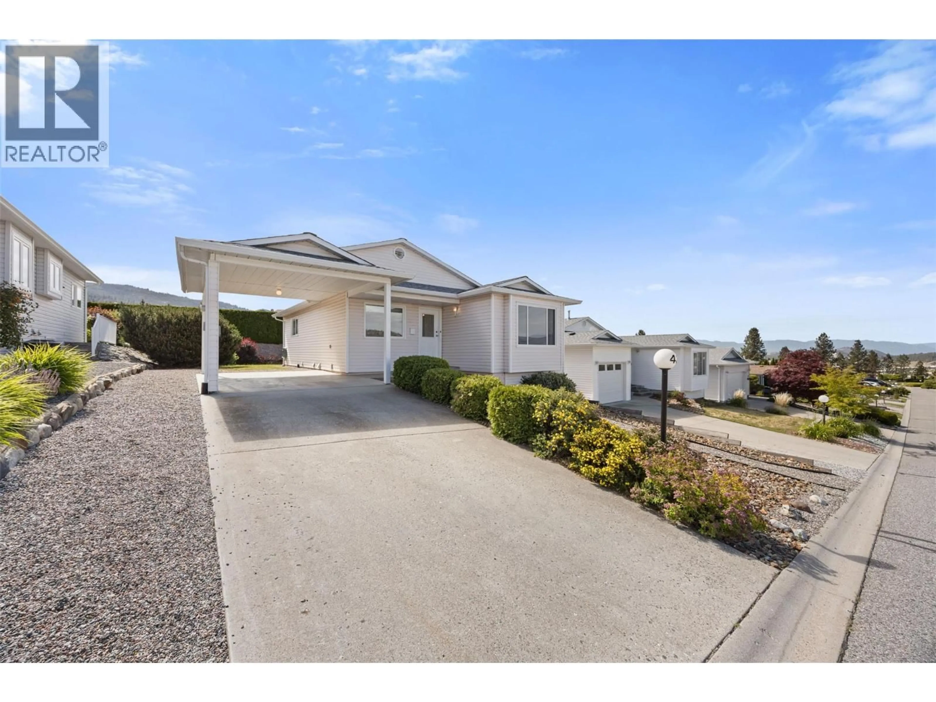 A pic from outside/outdoor area/front of a property/back of a property/a pic from drone, street for 43 - 6400 SPENCER ROAD, Kelowna British Columbia V1X7T6