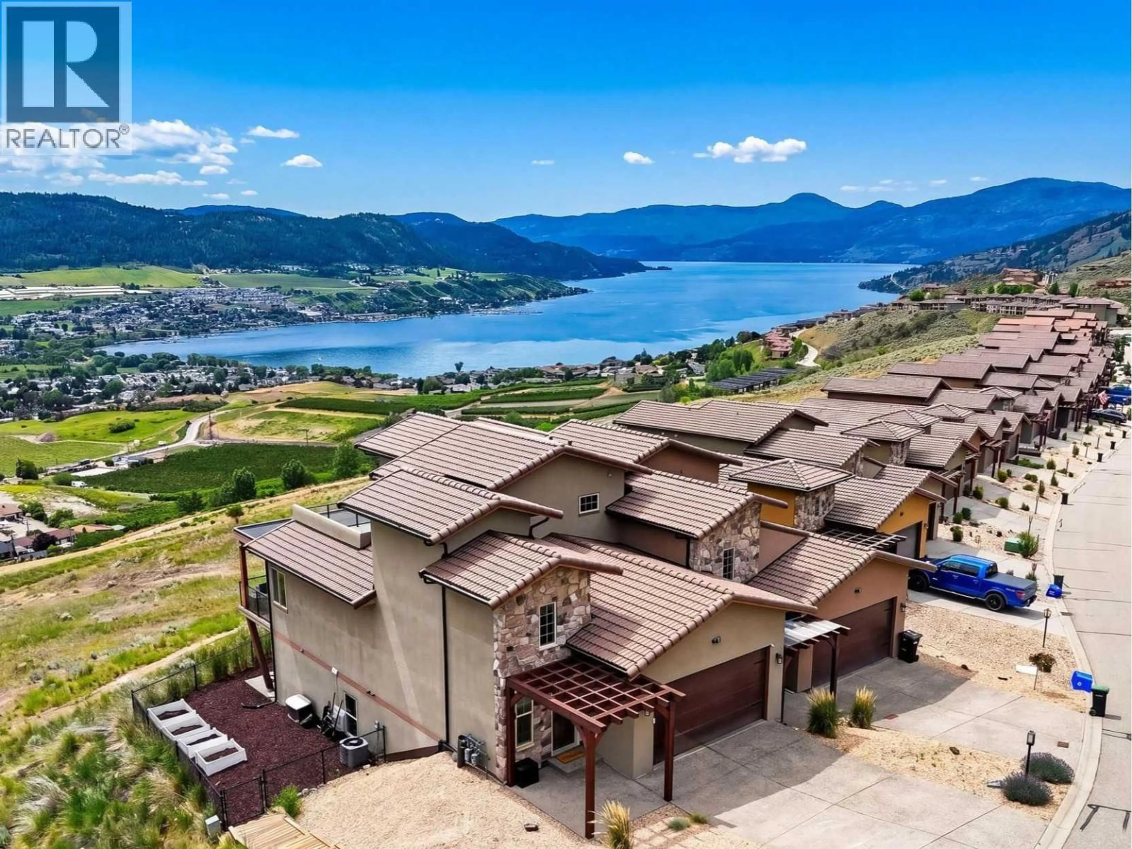 A pic from outside/outdoor area/front of a property/back of a property/a pic from drone, water/lake/river/ocean view for 1 - 595 VINEYARD WAY NORTH, Vernon British Columbia V1H2M2