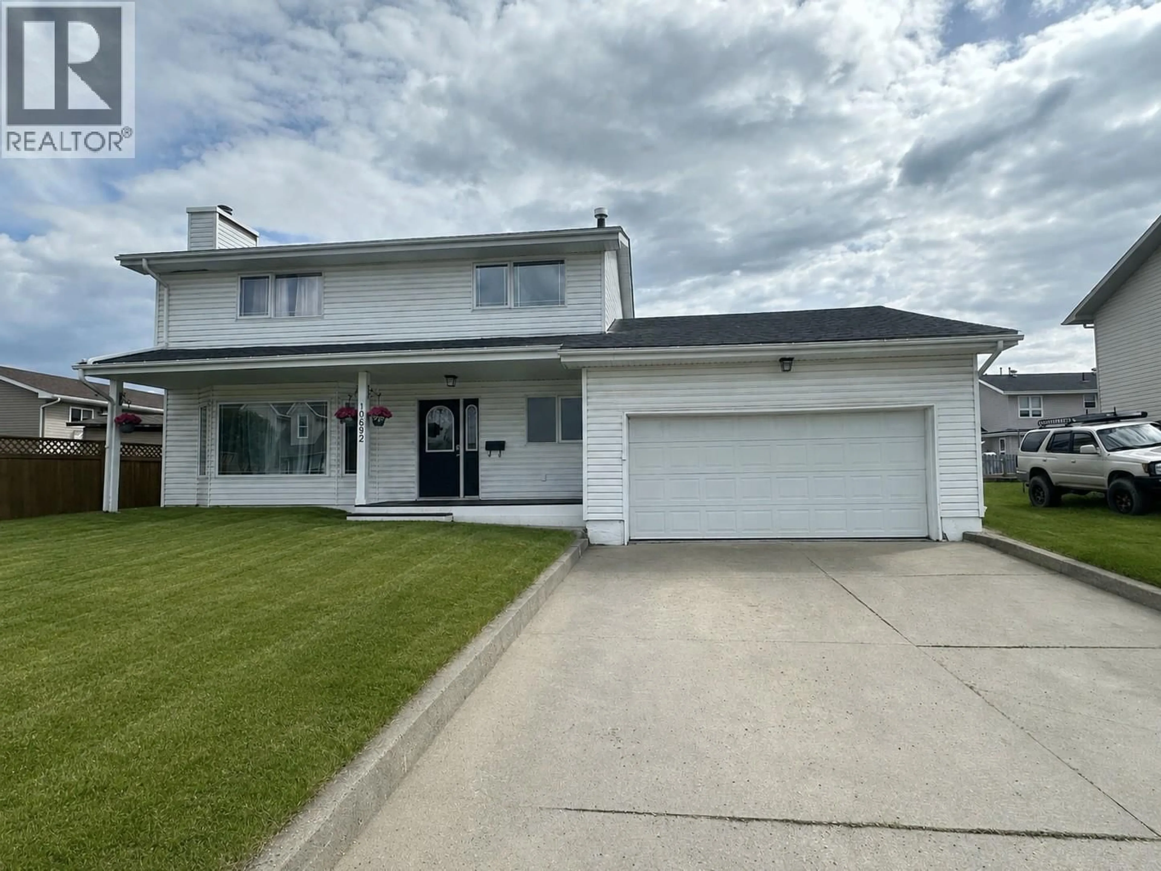 Home with vinyl exterior material, street for 10692 COTTONWOOD CRESCENT, Dawson Creek British Columbia V1G4M4
