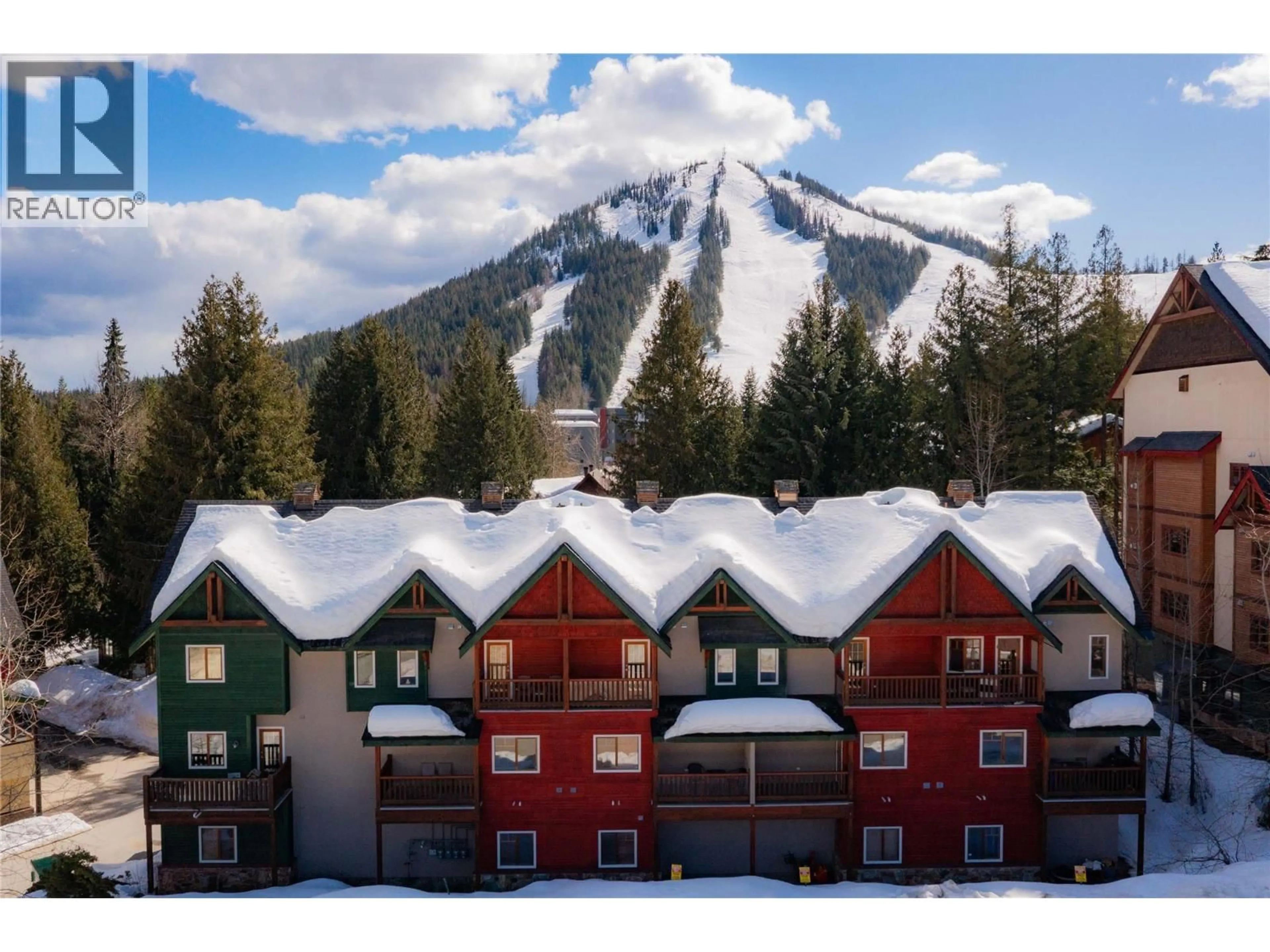 A pic from outside/outdoor area/front of a property/back of a property/a pic from drone, mountain view for D - 1003 MOUNTAIN VIEW ROAD, Rossland British Columbia V0G1Y0