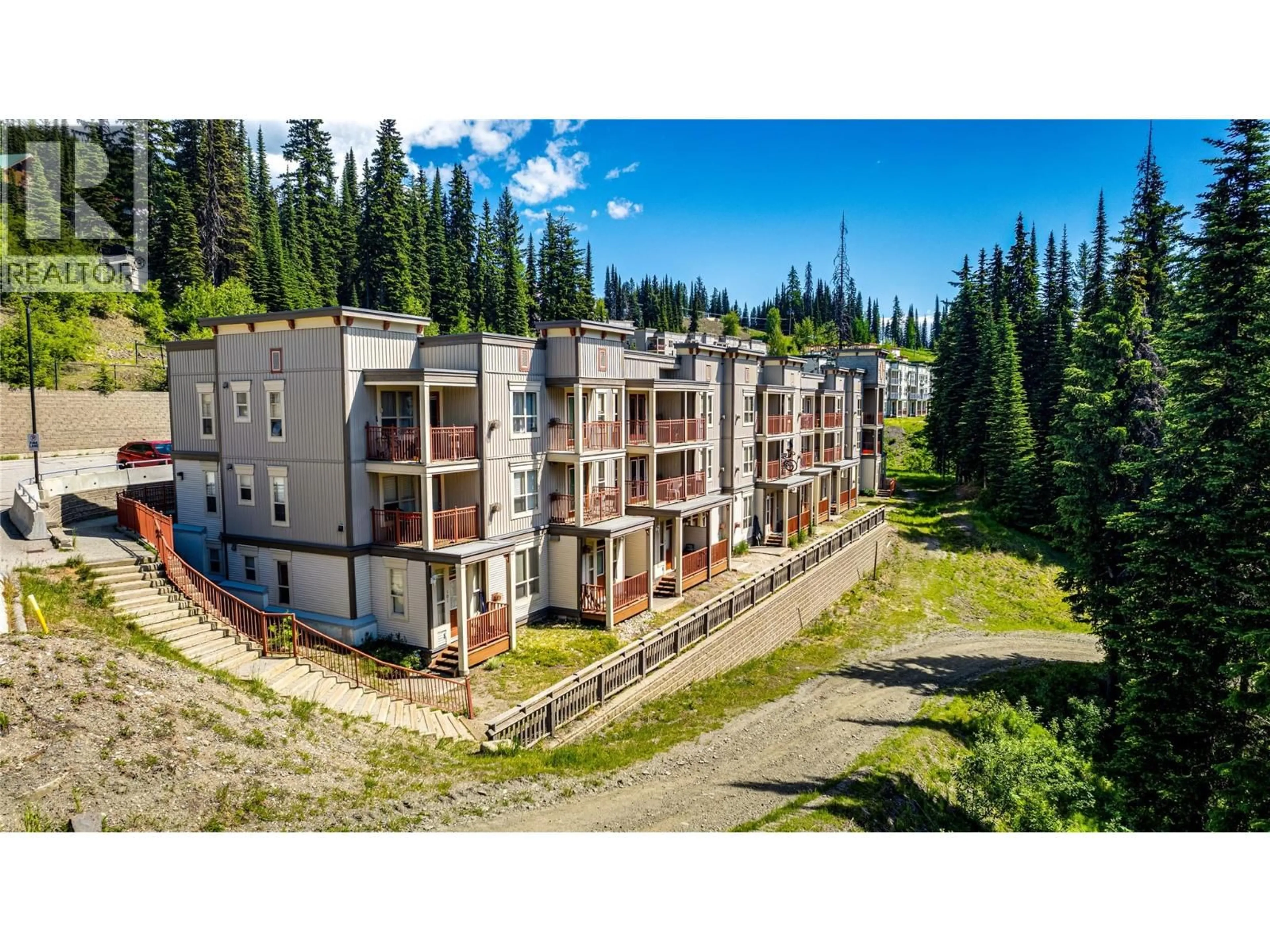 A pic from outside/outdoor area/front of a property/back of a property/a pic from drone, unknown for 202 - 9812 SILVER STAR ROAD, Vernon British Columbia V1B3Y9
