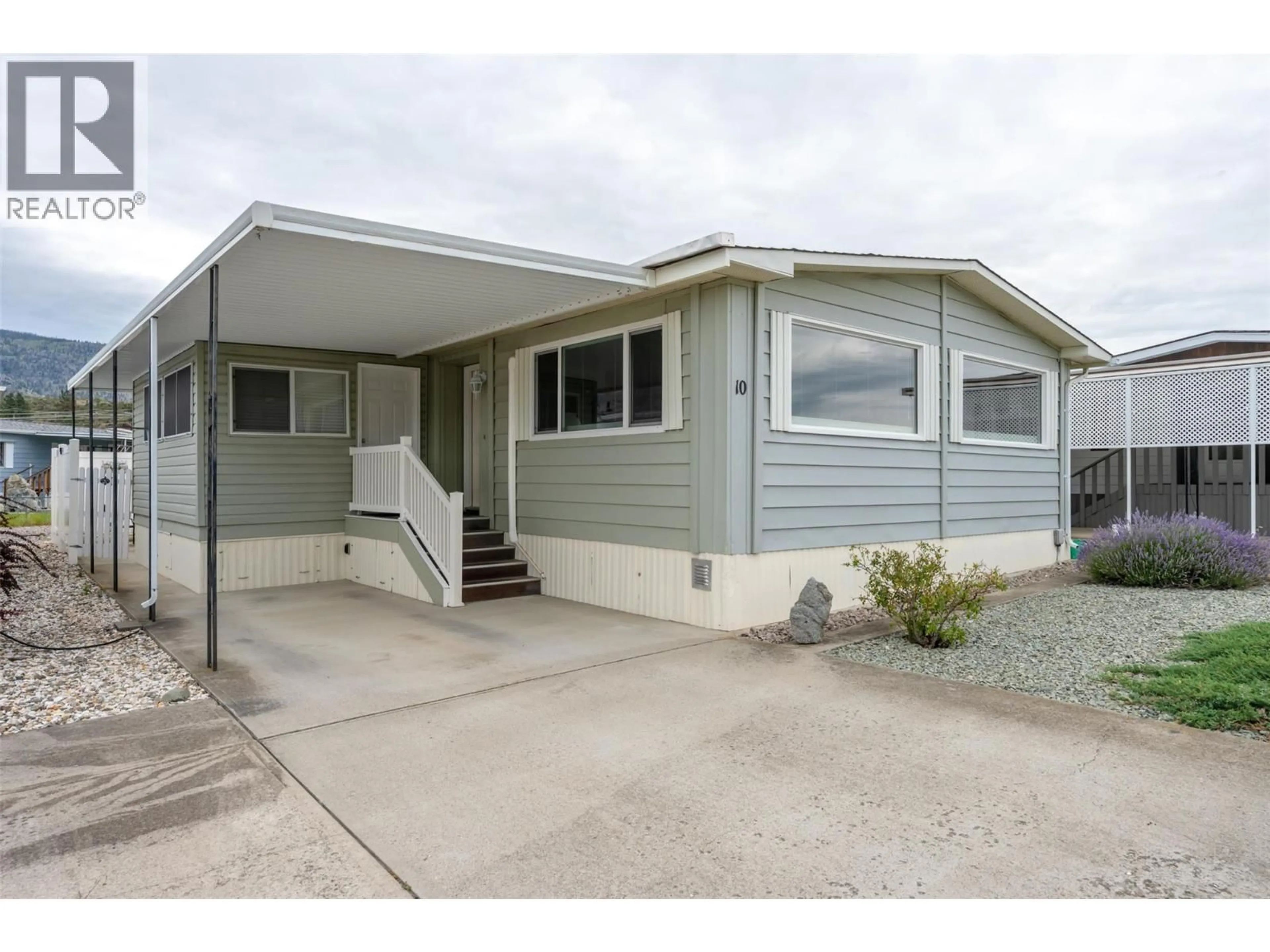 Home with vinyl exterior material, street for 10 - 6601 TUCELNUIT DRIVE, Oliver British Columbia V0H1T3