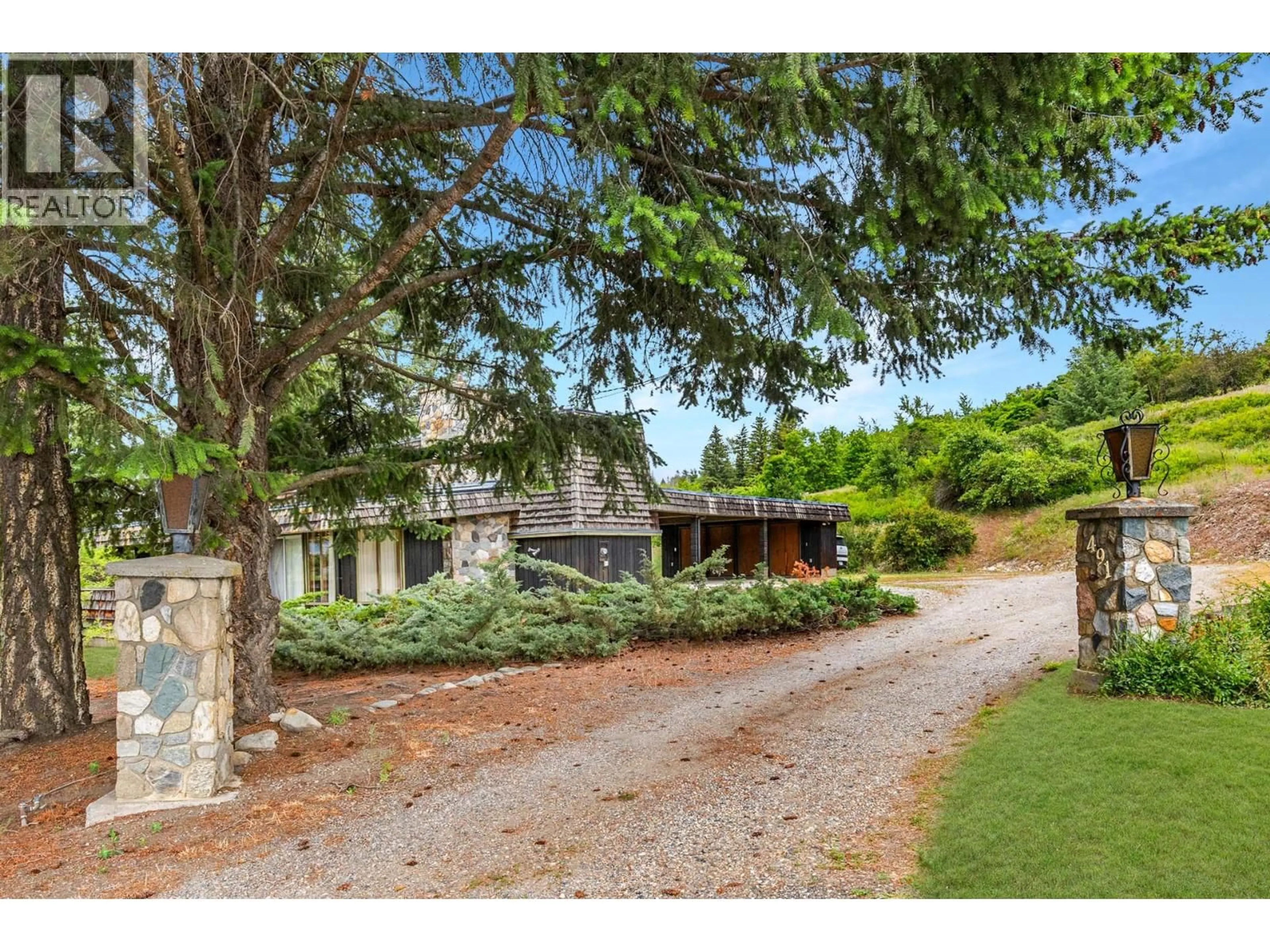 A pic from outside/outdoor area/front of a property/back of a property/a pic from drone, unknown for 491 MCLEISH ROAD, Vernon British Columbia V1B3H5
