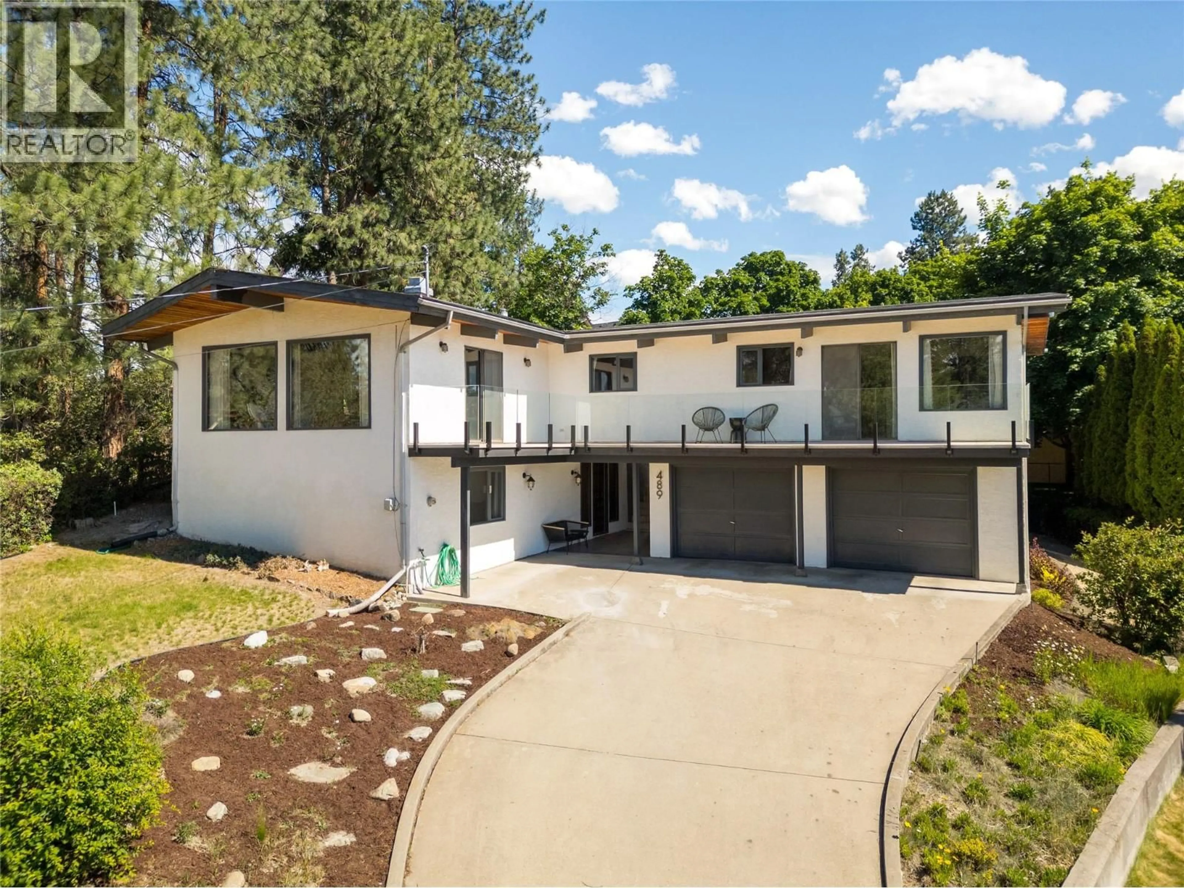 Home with vinyl exterior material, street for 489 OKAVIEW ROAD, Kelowna British Columbia V1W4M1
