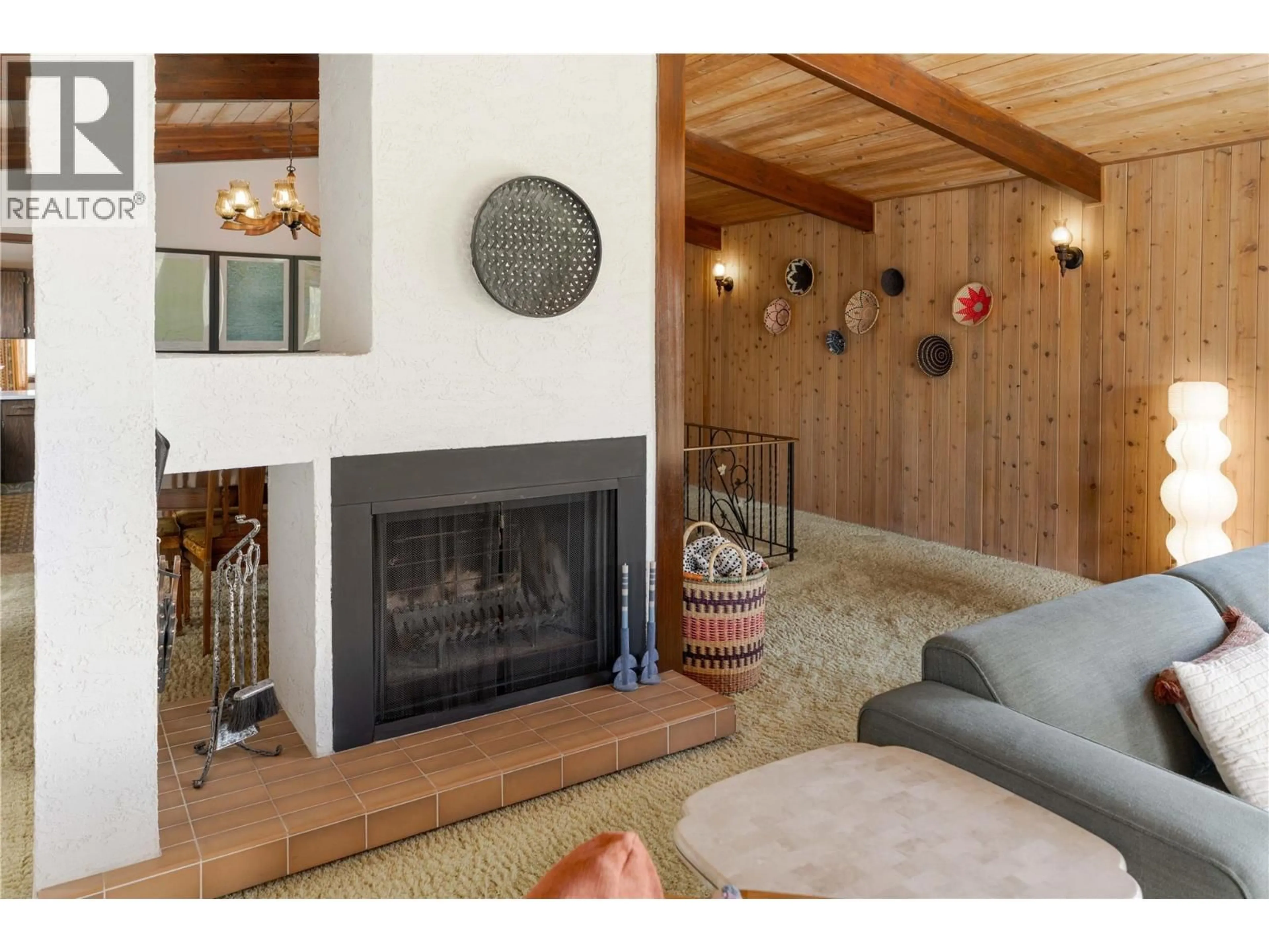 Living room with furniture, wood/laminate floor for 489 OKAVIEW ROAD, Kelowna British Columbia V1W4M1