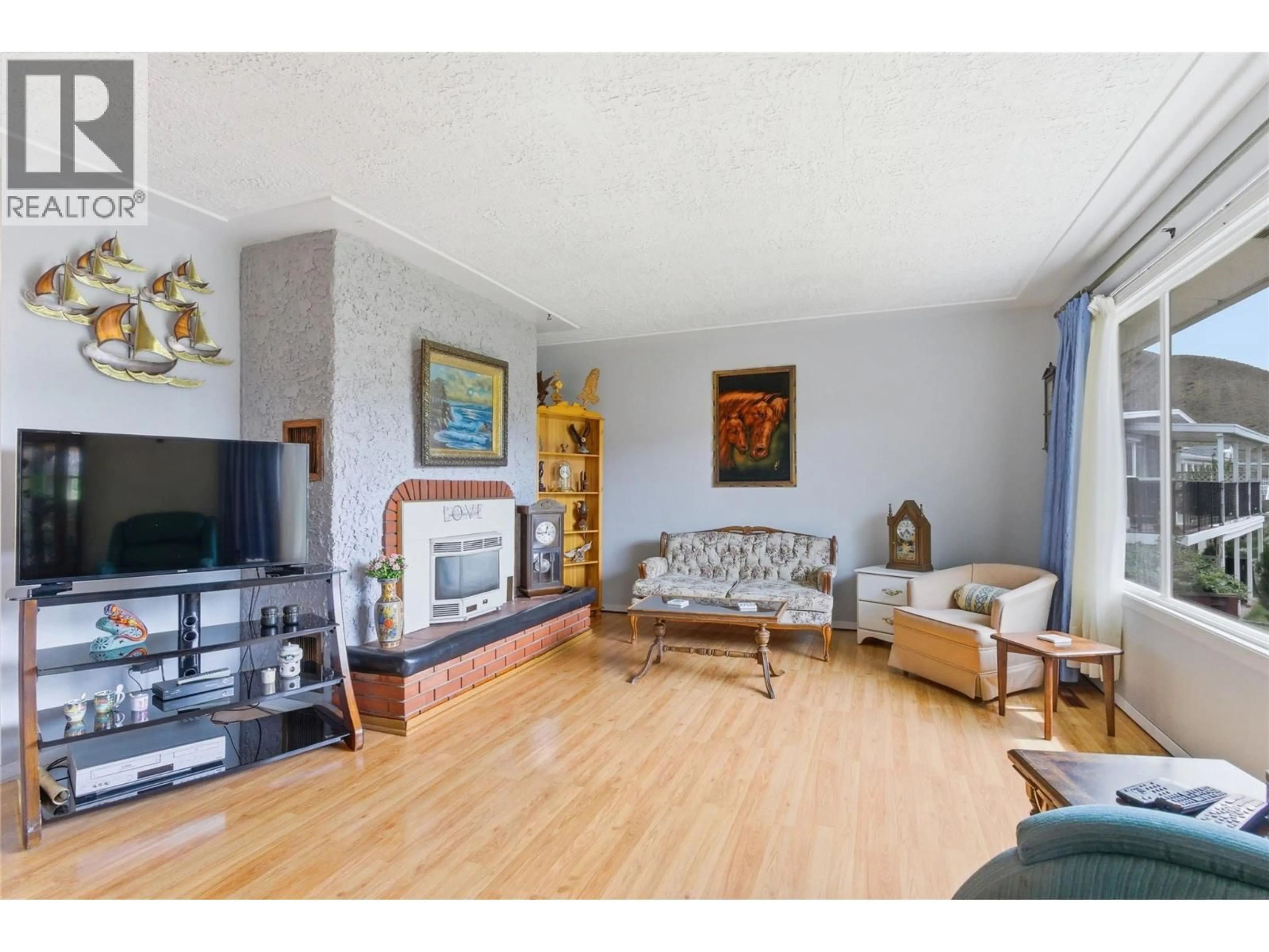 Living room with furniture, wood/laminate floor for 1332 MESA VISTA DRIVE, Ashcroft British Columbia V0K1A0