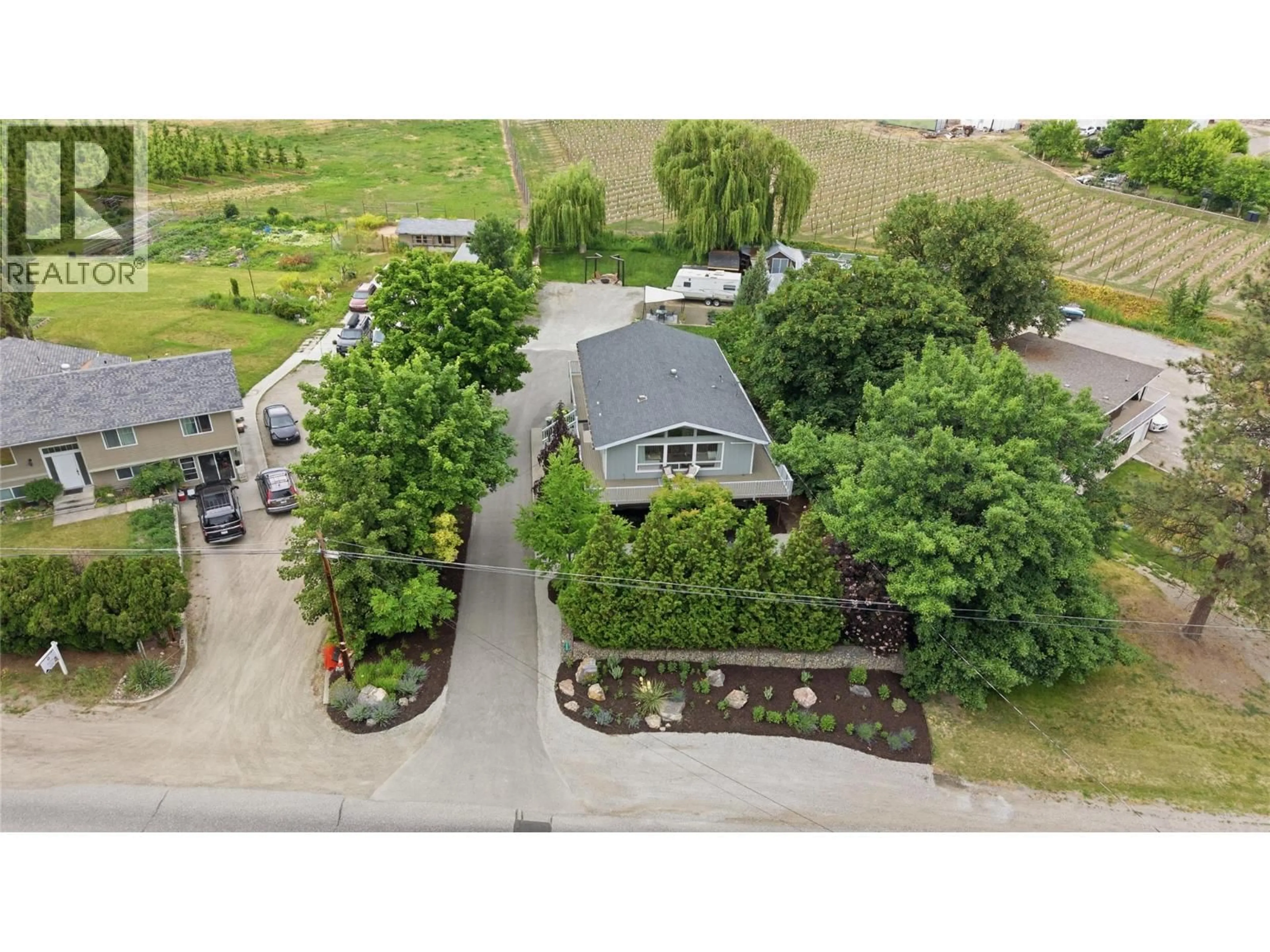 A pic from outside/outdoor area/front of a property/back of a property/a pic from drone, street for 2668 LONGHILL ROAD, Kelowna British Columbia V1V2G5