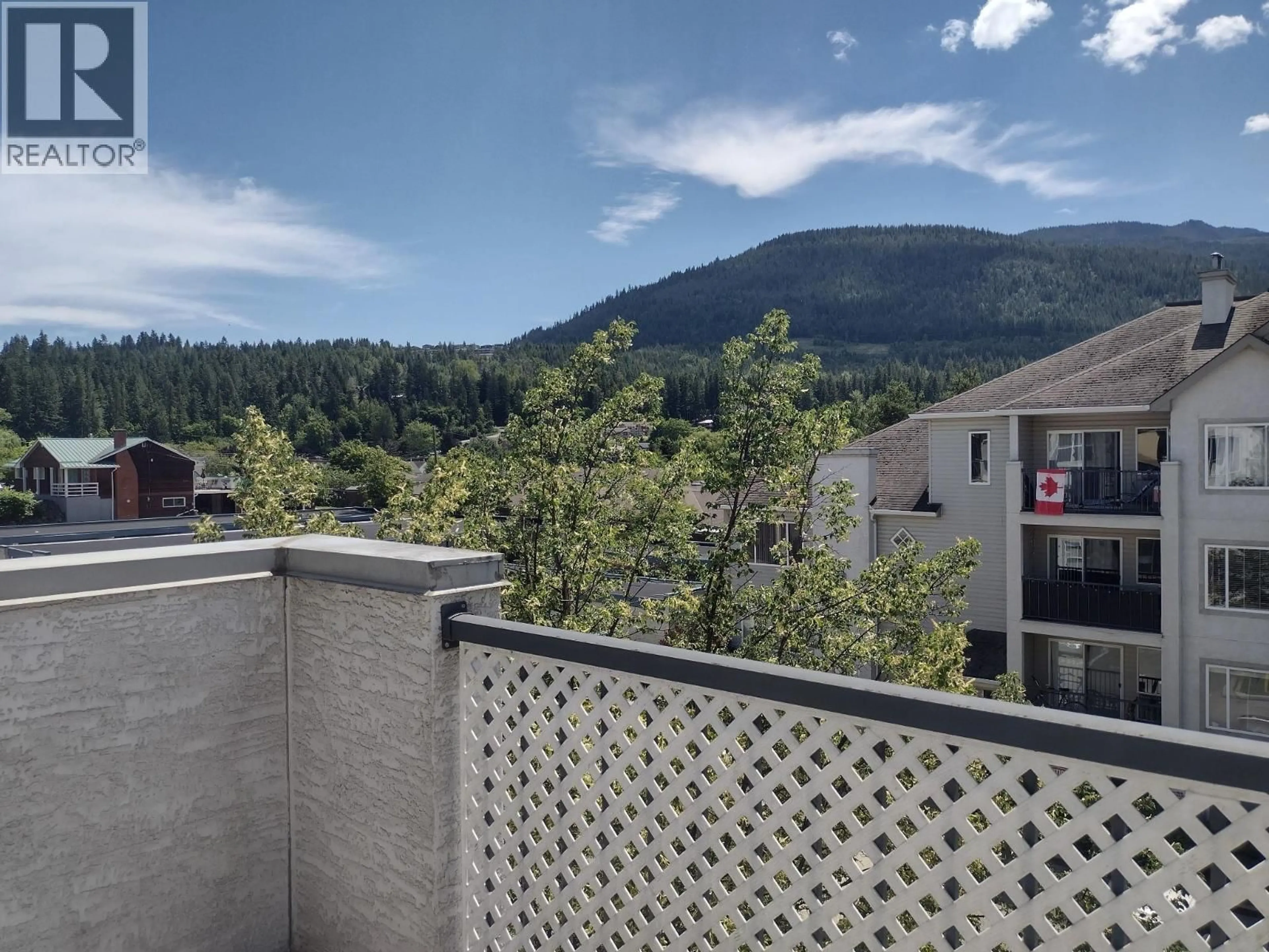 Balcony in the apartment, city buildings view from balcony for 406 - 640 3 STREET SOUTHWEST, Salmon Arm British Columbia V1E2R3
