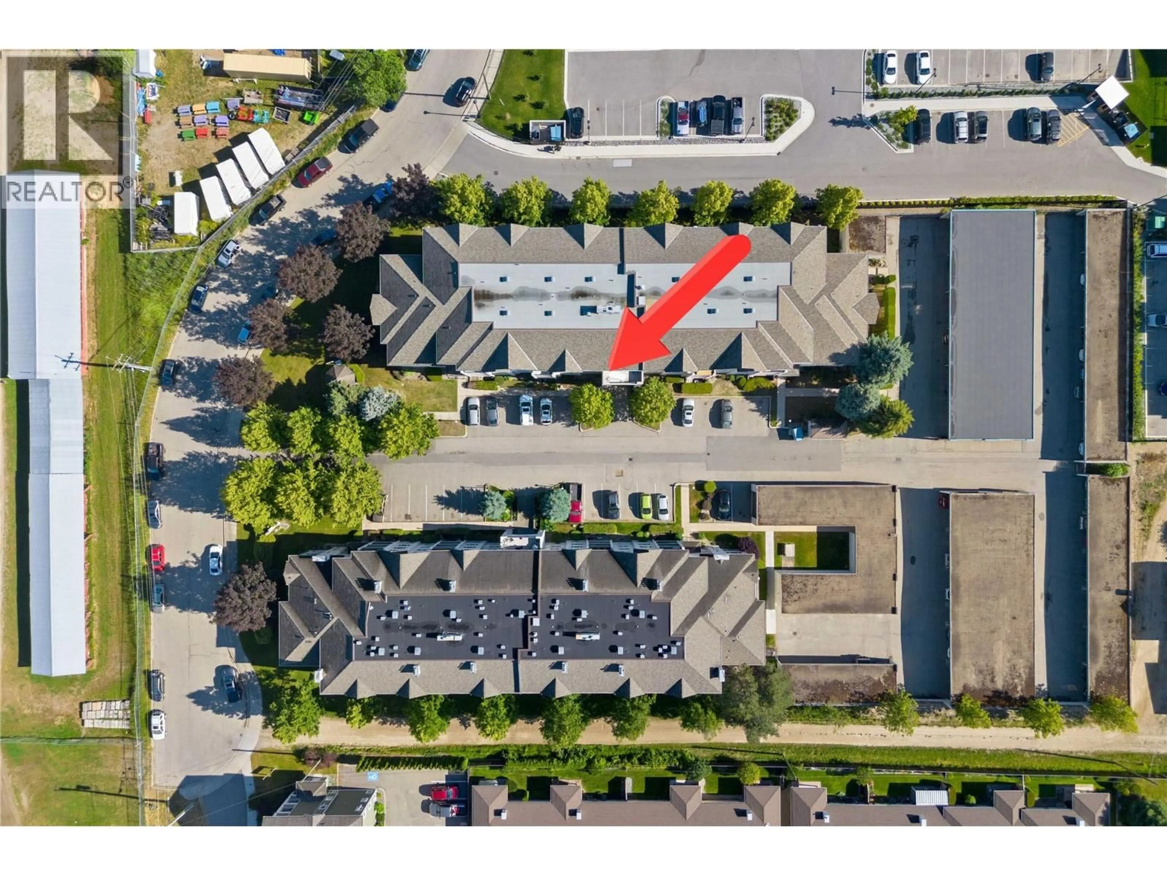 A pic from outside/outdoor area/front of a property/back of a property/a pic from drone, street for 406 - 640 3 STREET SOUTHWEST, Salmon Arm British Columbia V1E2R3